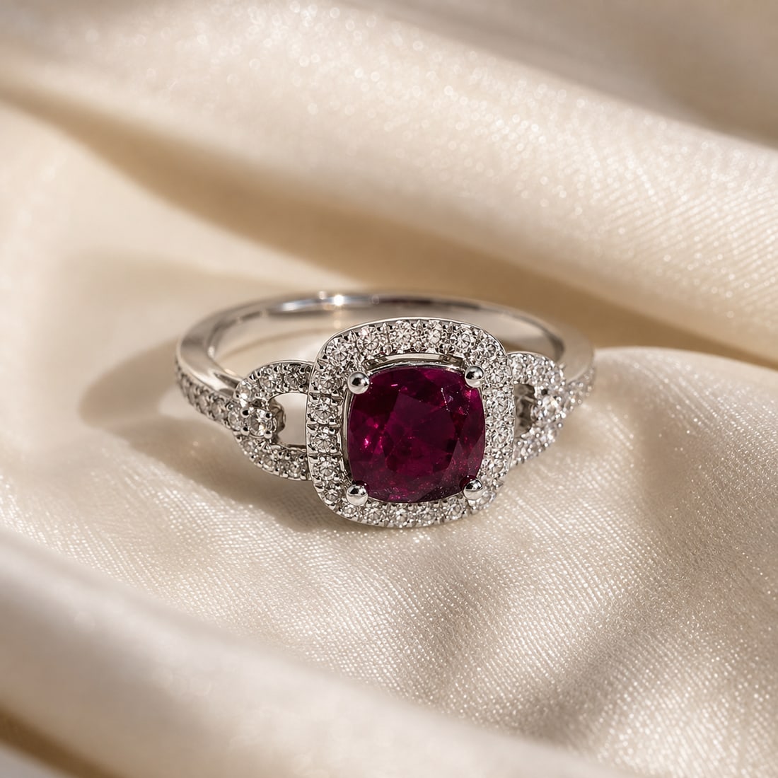 14K White Gold Unheated Kashmir Sapphire & Diamond Ring with AIGL Appraisal: Elegant 14K white gold ring centered with a cushion-shaped rare unheated Kashmir sapphire, surrounded by a halo of round diamond accents. Additional diamonds embellish the split-style shoulders for ad