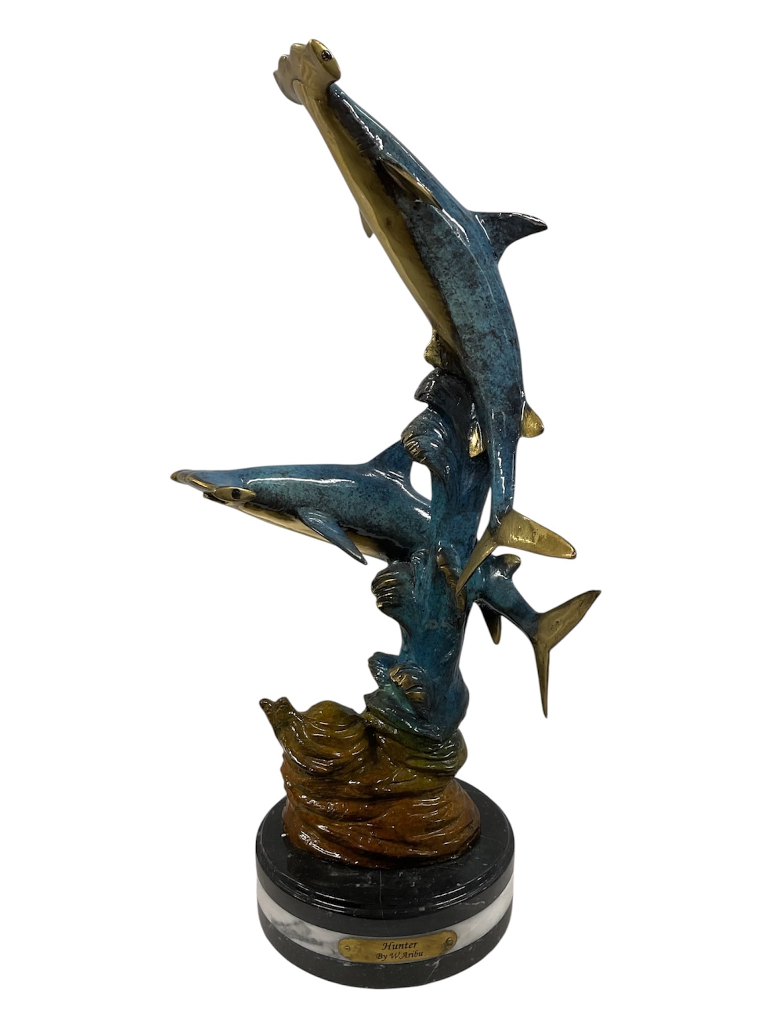 W. Aribu Hunter Limited Edition Bronze Hammerhead Shark Sculpture 1/300: A large limited-edition bronze sculpture by W. Aribu titled Hunter, depicting three hammerhead sharks swimming upward through a stylized underwater composition. The sharks feature a rich blue-green pa