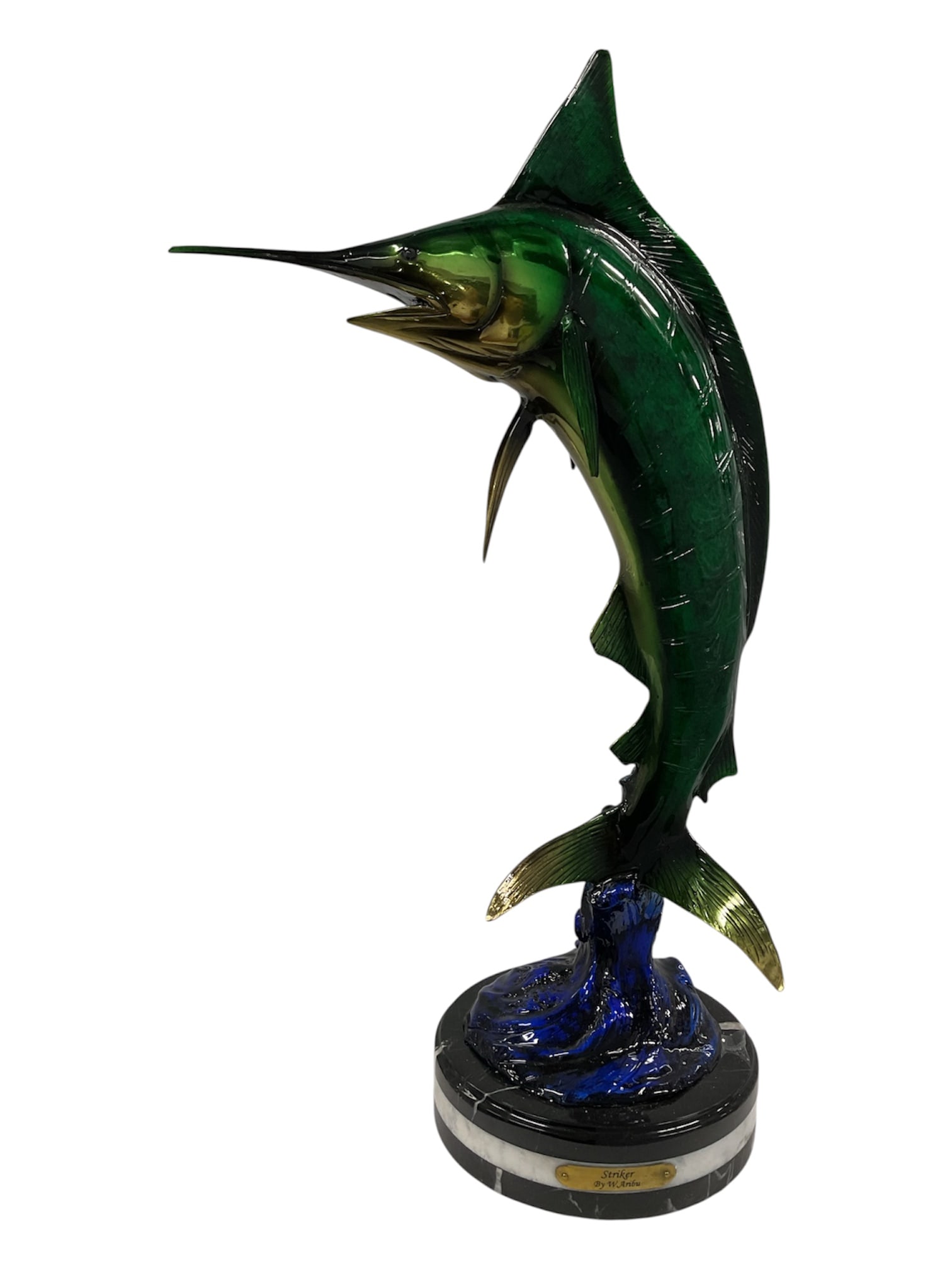 W. Aribu Striker Polychrome Bronze Marlin Sculpture: A dramatic bronze sculpture by W. Aribu titled Striker, depicting a large marlin surging upward from stylized ocean waves. The fish is dynamically modeled with a long pointed bill, open mouth, promine
