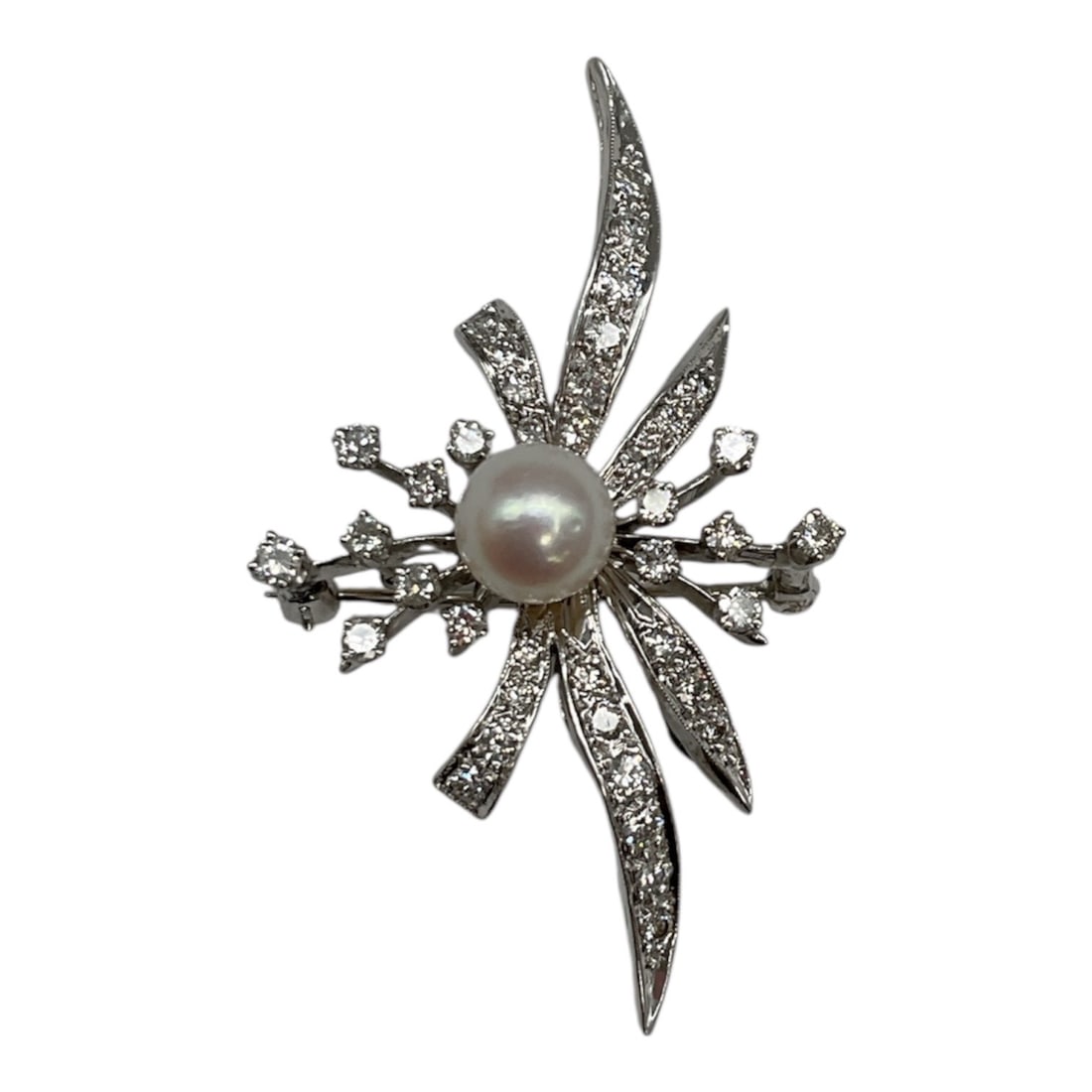 14K Gold Diamond and Pearl Pendant/Brooch, Approx. 1.00 Carat Total Weight: An elegant 14K white gold pendant/brooch featuring a dynamic, abstract spray design centered around a lustrous pearl. The composition is accented with numerous diamonds, totaling approximately 1.00 ca