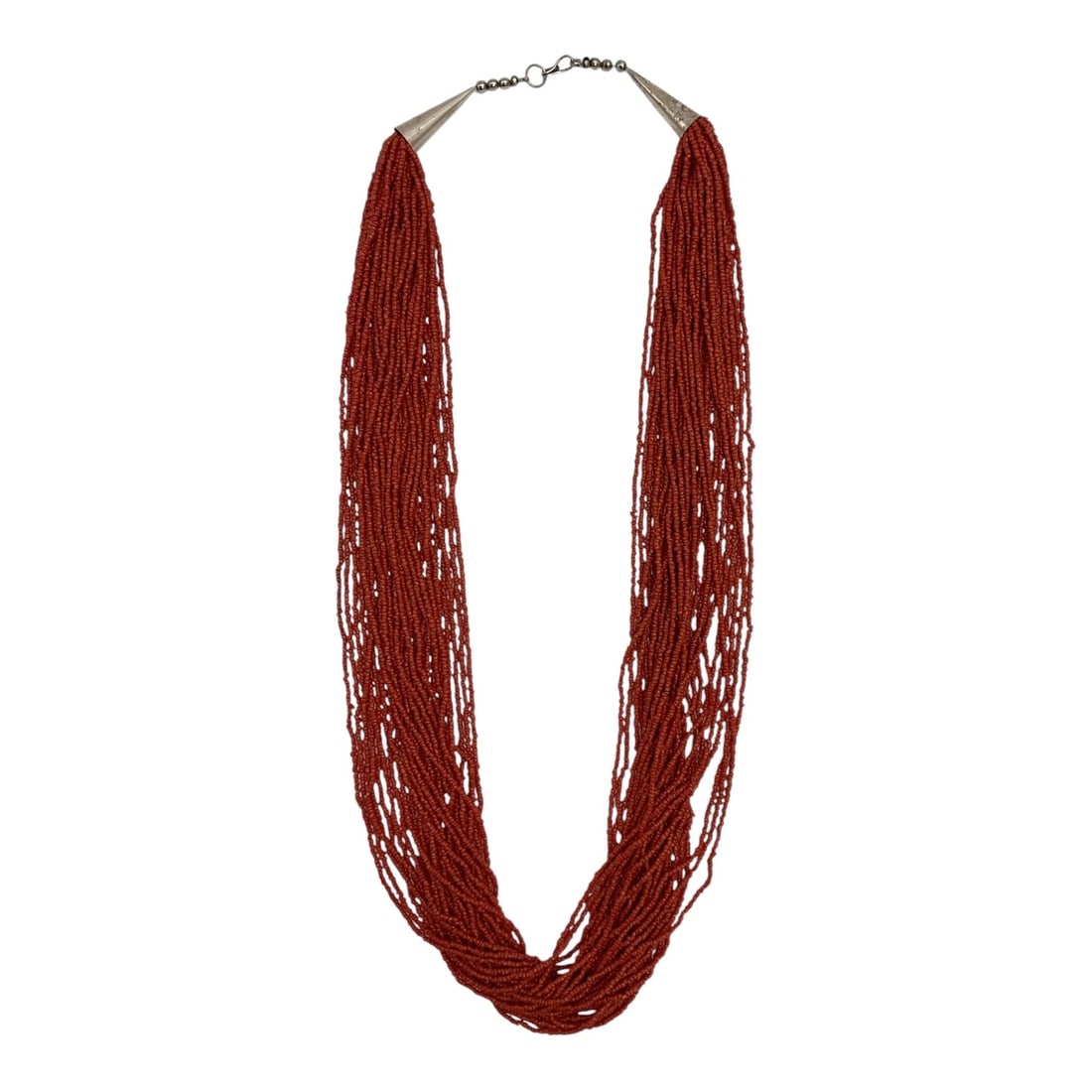 Multi-Strand Red Coral Bead Necklace with Sterling Silver Clasp: Elegant multi-strand necklace composed of numerous strands of small red coral beads, gathered into sterling silver end caps with a sterling silver clasp closure. The cascading strands create a dramati
