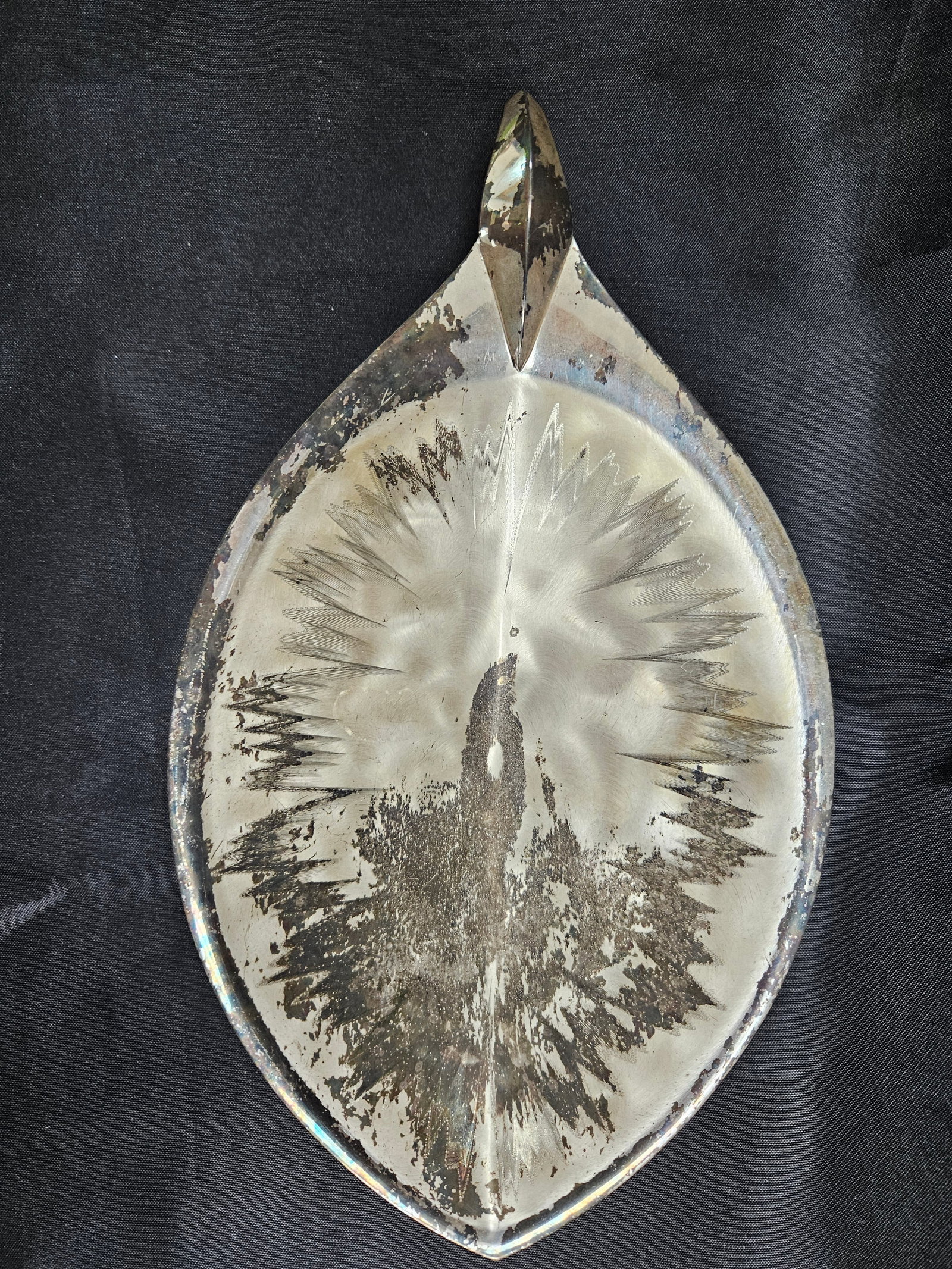 Ikora Germany Silverplate Leaf Dish: Ikora Germany silverplate leaf-shaped dish. Features a pointed handle and rests on two ball feet. Marked on the underside. Measures approximately 9.5 inches long. nbsp; approx 12 in L x 6 1/2 W x 2