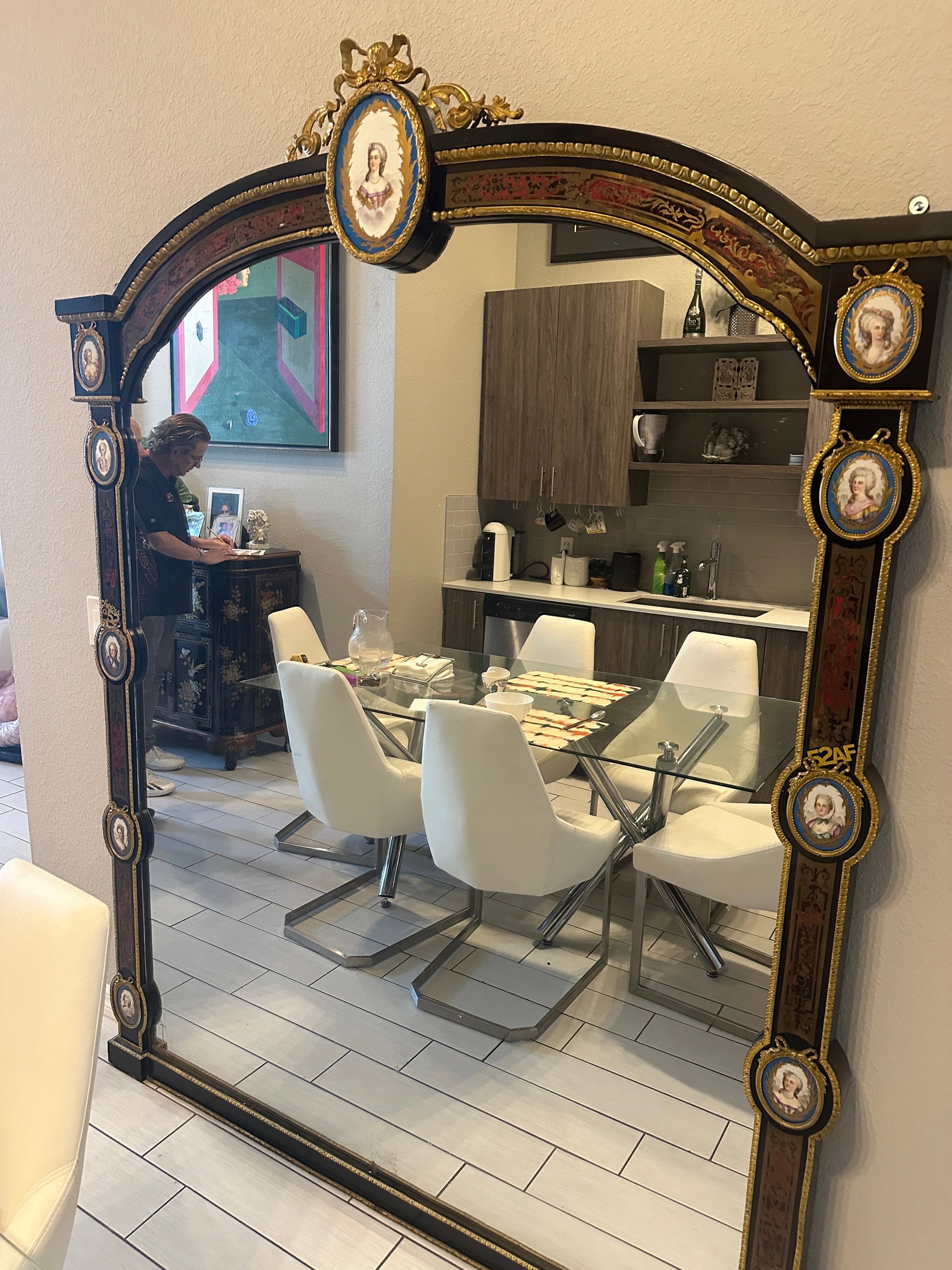 Empire Style Neoclassical Mirror with Enamel Inserts: Description: Palatial sized empire style neoclassical mirror, with enamel inserts and gilt bronze ormolu detailing. Dimensions: H:88in W:67in