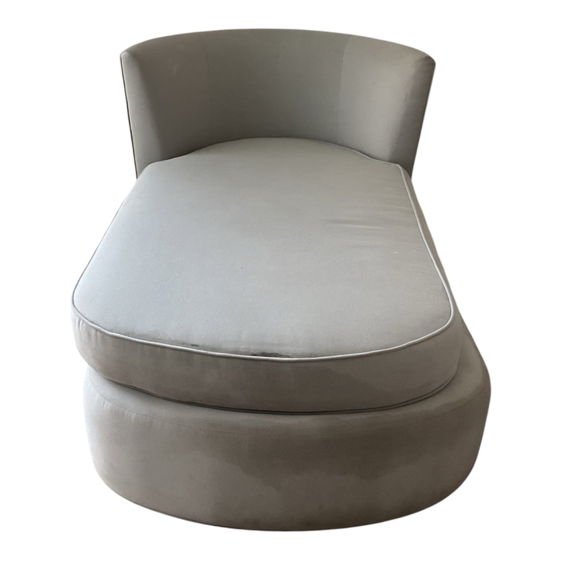 Contemporary Curved Upholstered Chaise Lounge: A contemporary chaise lounge featuring a sculptural curved silhouette with a rounded upholstered base, generously padded seat cushion, and wraparound backrest. The streamlined, low-profile design is u