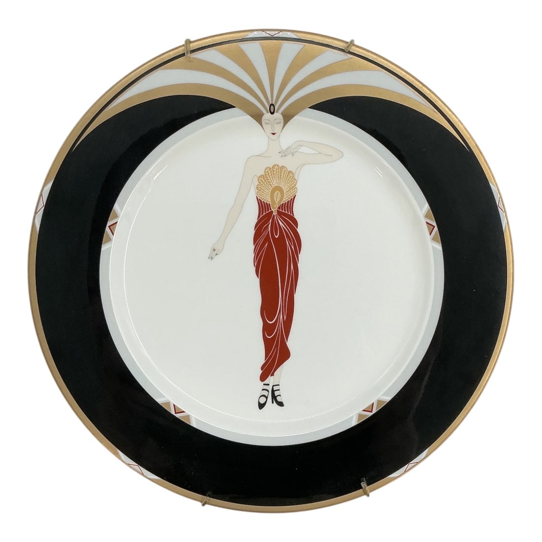 Le Soleil Ebony by Erte (Russian-French, 1892-1990) Bone China Collector Plate: SPECIFICATIONS Medium: Bone China Collector Plate Artist: Erte Maker: Bone China Japan Dimensions: 12" x 12" Subject: Le Soleil Ebony, A3049/1985 KEYWORDS erte le soleil ebony collect