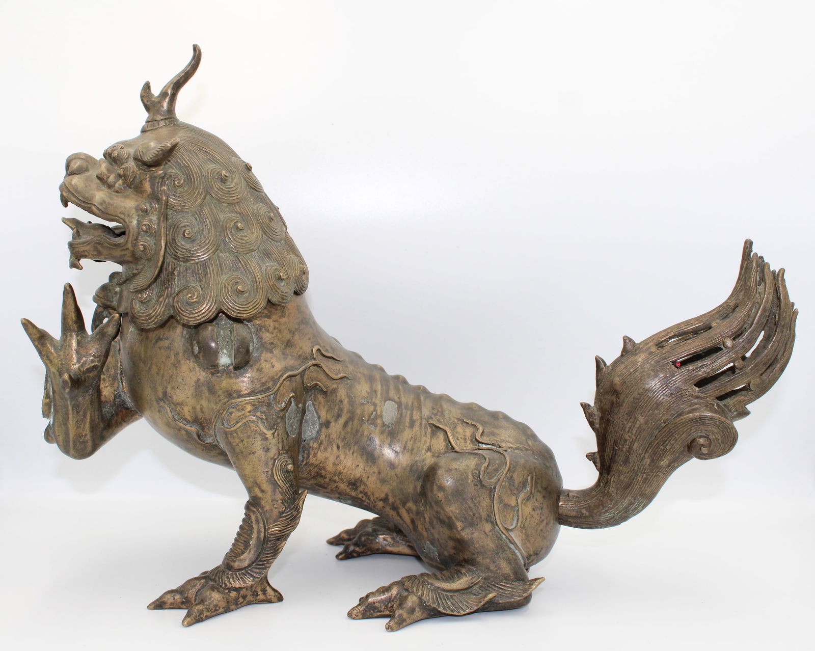 18th-century Chinese bronze Buddhist lion featuring intricate craftsmanship. Remarkably detailed (1 of 6)