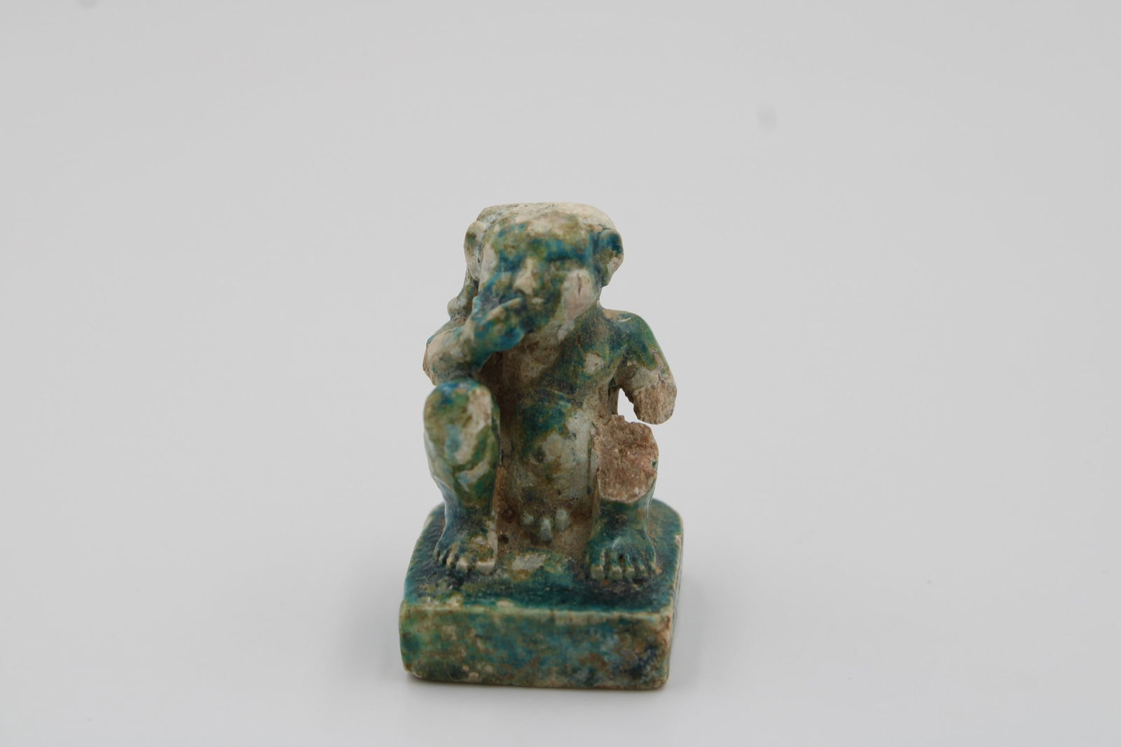 Egyptian Ptolemaic or later era, depicts a squatting man. height: 4 cm (1 of 3)