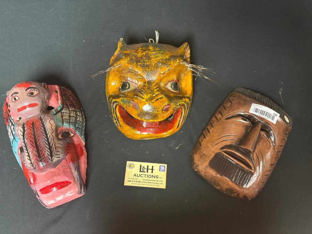 3 Painted, carved masks: 3 Painted, carved masks