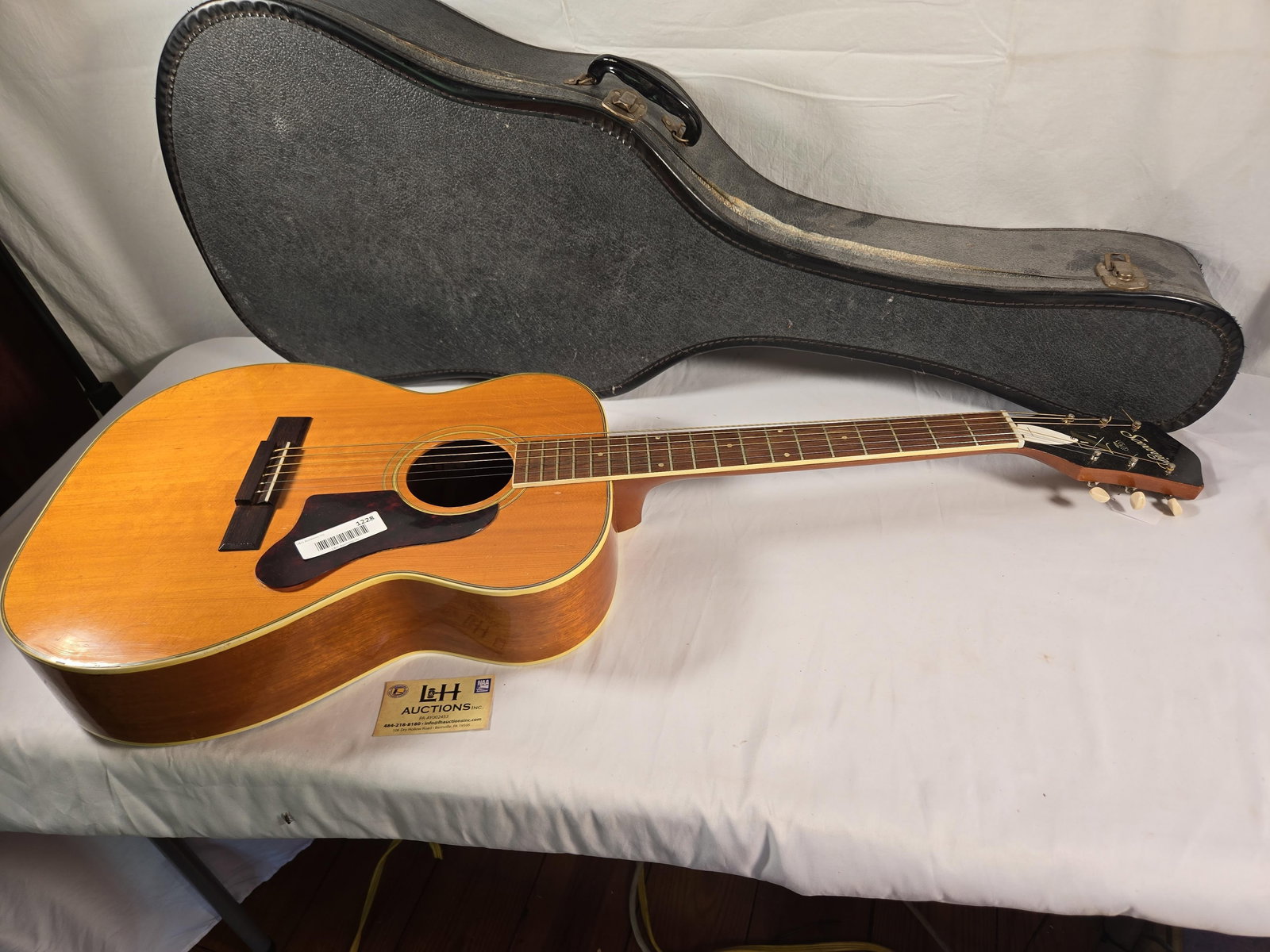 Sovereign acoustic guitar.: Sovereign acoustic guitar. Numbers inside faded, but appear to be 343441203. With as is a case