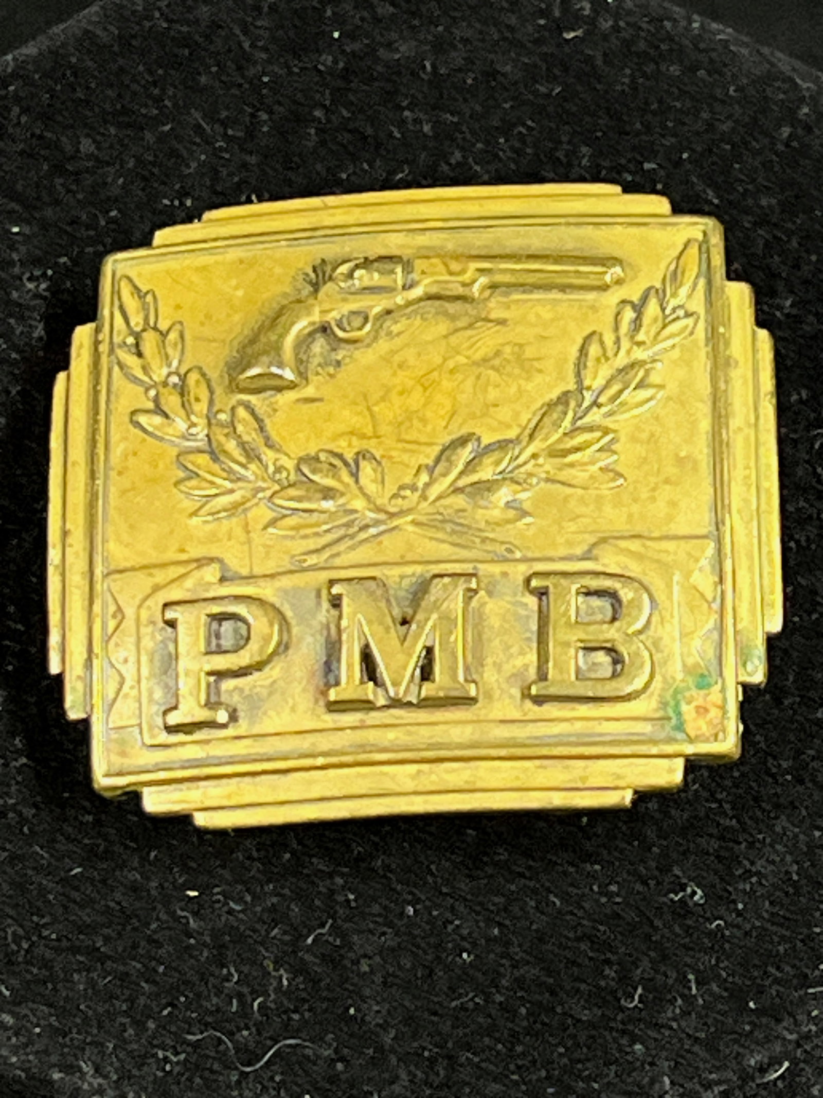 Antique PMB Buckle Featuring Military-Style Civil War Colt Pistol: An Antique Locking PMB Belt Buckle Featuring A Military-Style Civil War Colt Pistol MEDIUM: Cast Brass DIMENSIONS: 1.75 x 1.75 inches CIRCA: Late 19th C. ATTRIBUTION: Stamp Marked DESCRIPTION: This sm