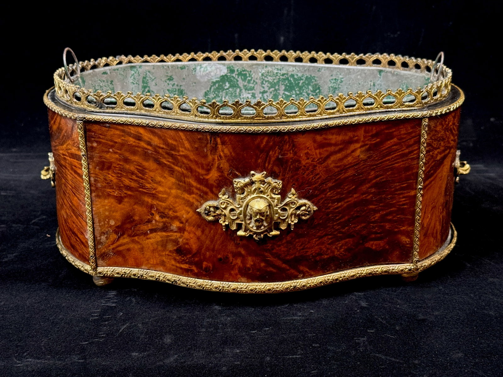 Antique Flame Burl and Brass Jardinere French Louis XV style: ITEM: Antique Flame Burl and Brass Jardinere French Louis XV style DESCRIPTION: Frame is constructed of flame burl mounted into gilt metal. Fitted at either end with ormolu handles. Side walls are dec