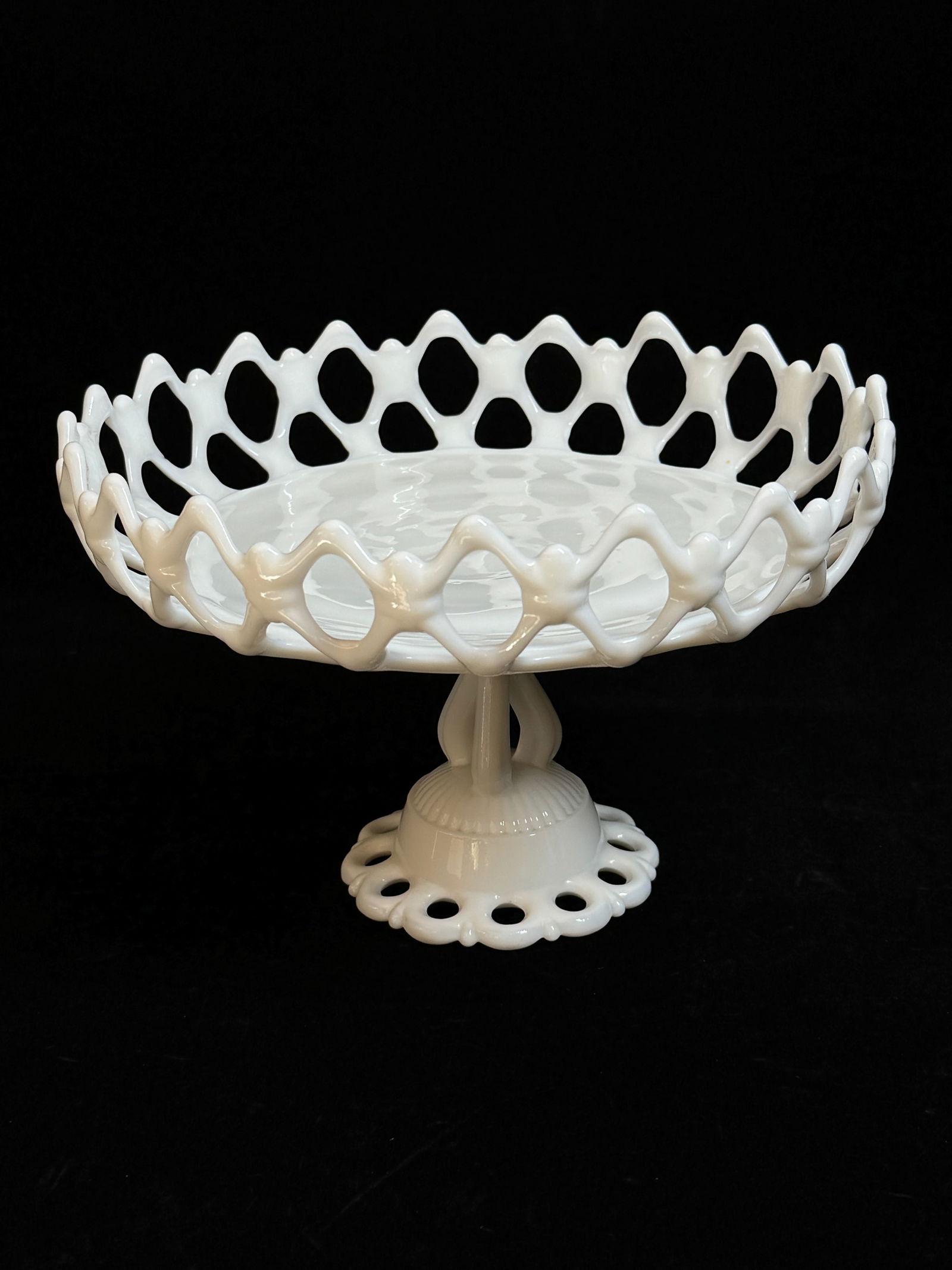 Milk glass fruit compote with a pierced gallery setting on a tri-form stem with a pierced foot (1 of 3)