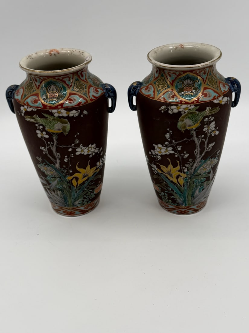 A Pair of Antique Japanese Late Meiji Period Mantel Vases: TITLE: A Pair of Antique Japanese Late Meiji Period Mantel Vases ATTRIBUTION: Japan MEDIUM: Hand painted and High Fired Ceramic DIMENSIONS: 9 x 5.5 inches each CIRCA: Early 20th Century. DESCRIPTION: 