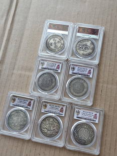 PCGS Gold Shield graded coins and box coins: PCGS Gold Shield graded coins and box coins, red paper-pasted silver dowry silver coins, seven Qing Dynasty Panlong silver coins, graded silver coins and box silver coins Provenance : Private collecti