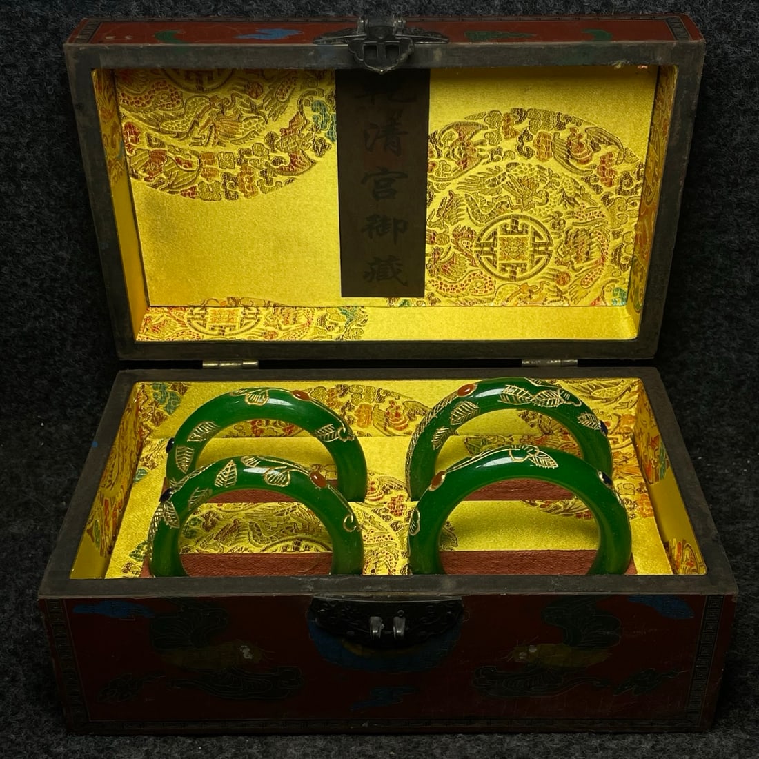 A jade-carved and gilded bracelet inside a lacquerware collection box made by the Qianlong Emperor (1 of 9)