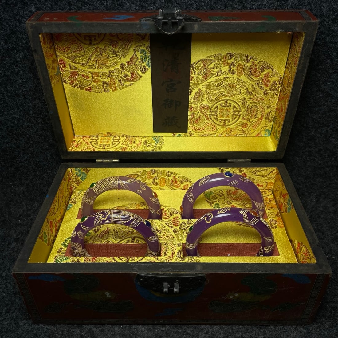 A jade-carved and gilded bracelet inside a lacquerware collection box made by the Qianlong Emperor (1 of 9)