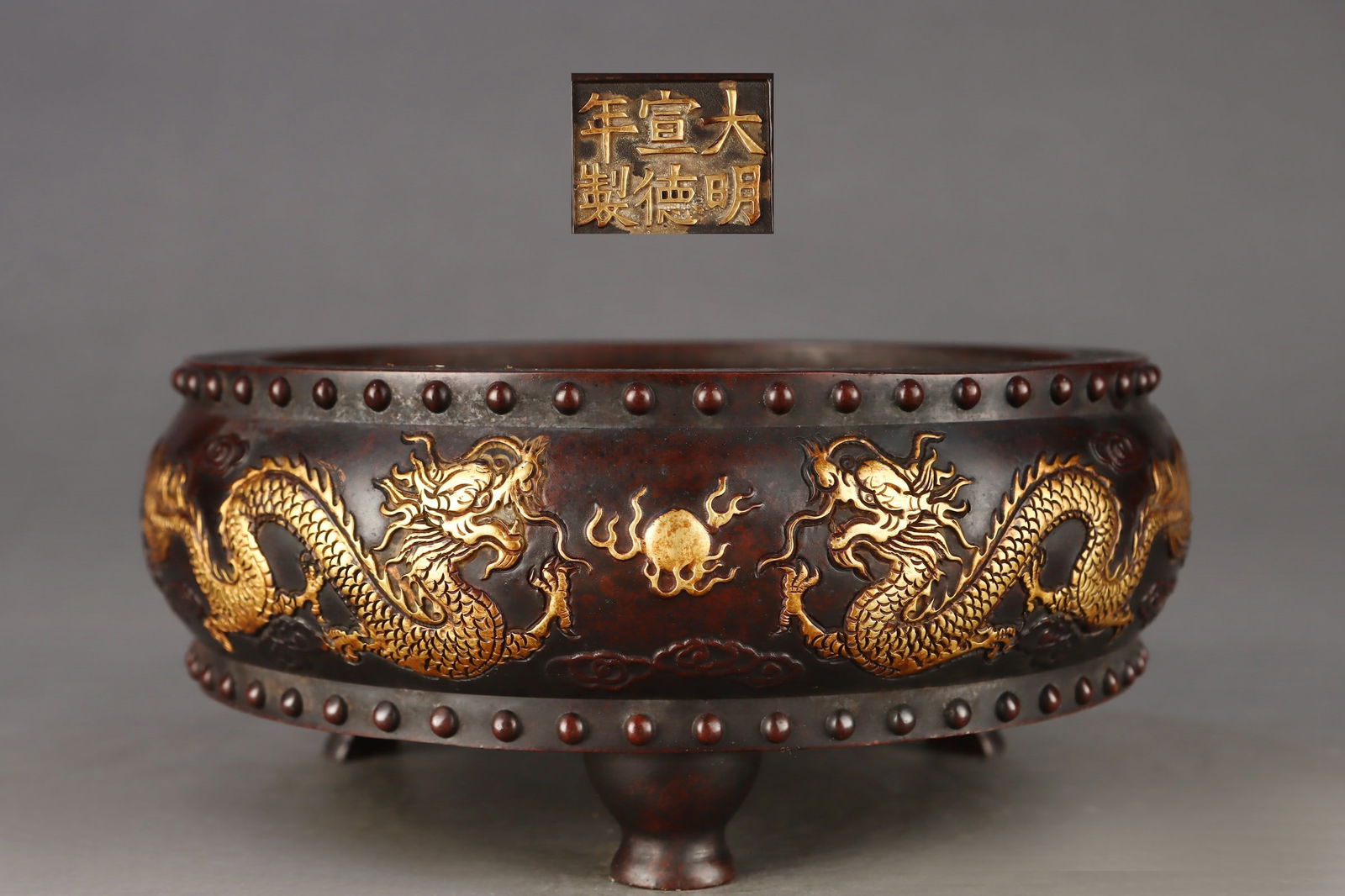 Gilded bronze drum-shaped censer with double dragons playing with a pearl design: Ming Dynasty finely cast, gilt bronze drum-shaped incense burner with a design of two dragons playing with a pearl. Dimensions: Height 9.2cm, Mouth Diameter 19.5cm, Belly Diameter 21cm. Provenance:Pri