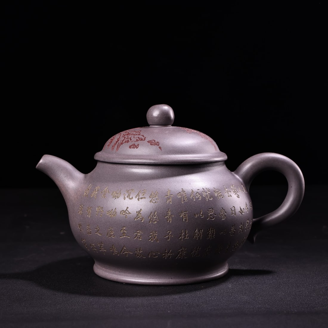 An antique, handcrafted celadon-purple clay teapot: An antique, handcrafted celadon teapot, exquisitely crafted, beautifully shaped, weighing 450 grams, 13 cm high and 18 cm wide. Provenance:A notable private collector in Kensington, London, United Kin