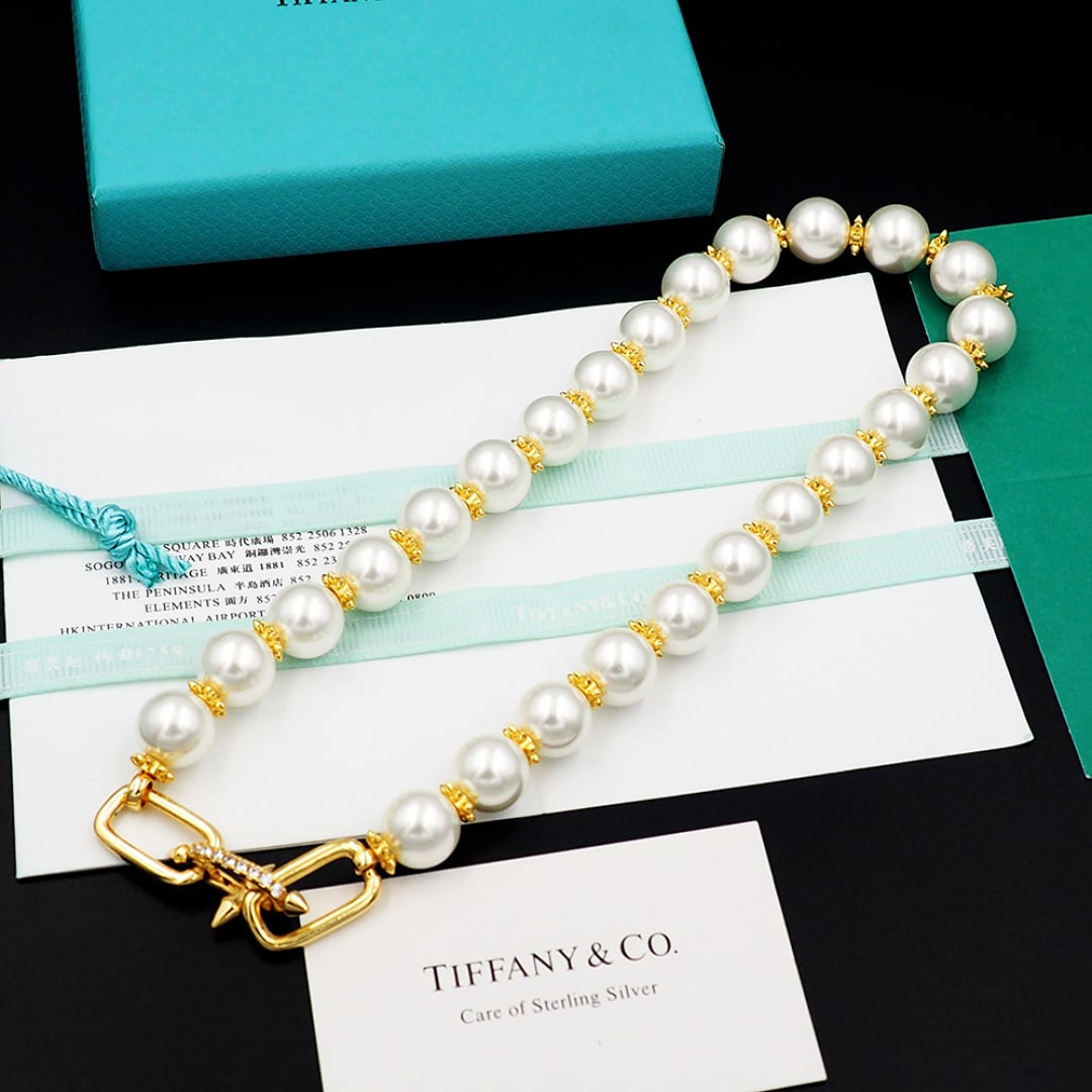 Tiffany necklace: The Tiffany Titan by Pharrell Williams collection embodies the creative power of a rebellious spirit. Inspired by Poseidon and his trident, the pieces are crafted from spiked, flat beads that interpla