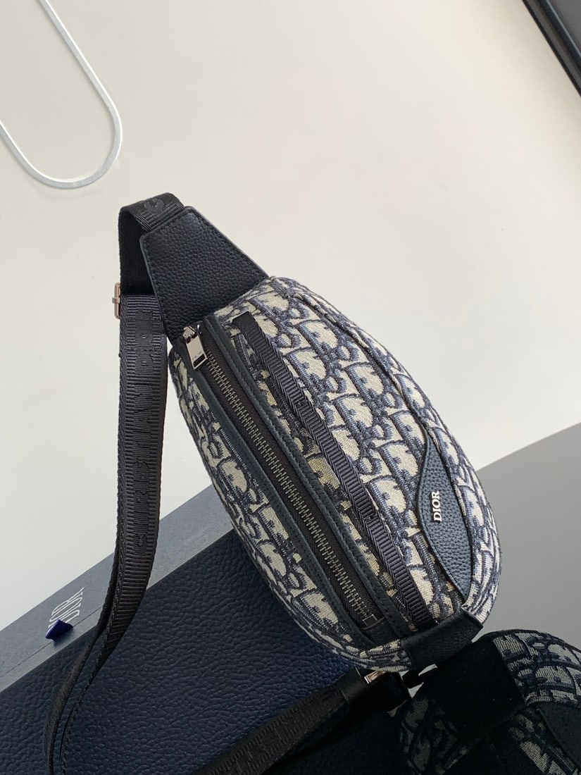 Christian Dior Scarab: The Dior Scarab handbag is a striking piece that seamlessly blends technological expertise with haute couture craftsmanship. Crafted from beige and black Oblique printed fabric and finished with black