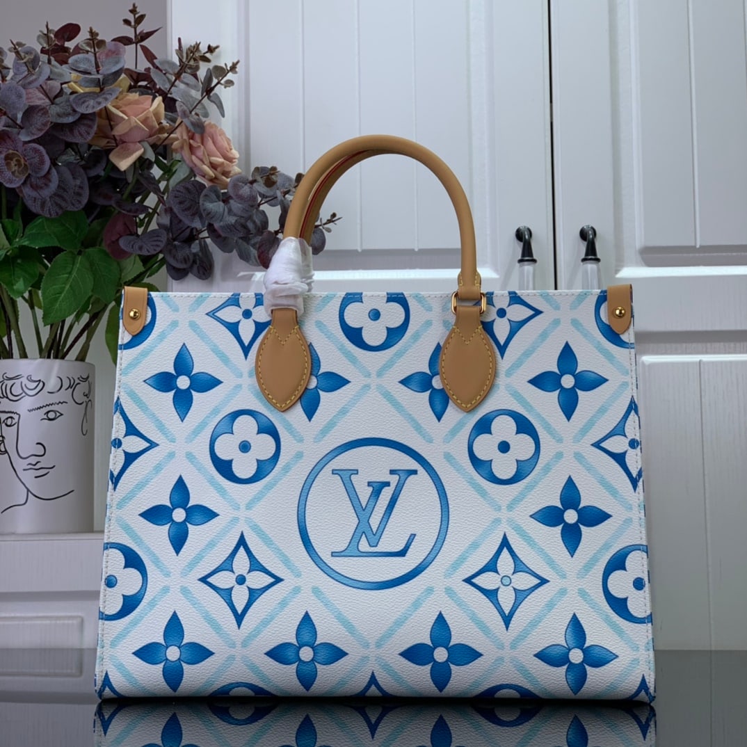 LV OnTheGo: The OnTheGo Medium M11262 Blue (Summer 2024) tote bag features a watercolor-effect Monogram print on Monogram Tiles canvas, with the LV Circle logo prominently displayed at the center. The handles and