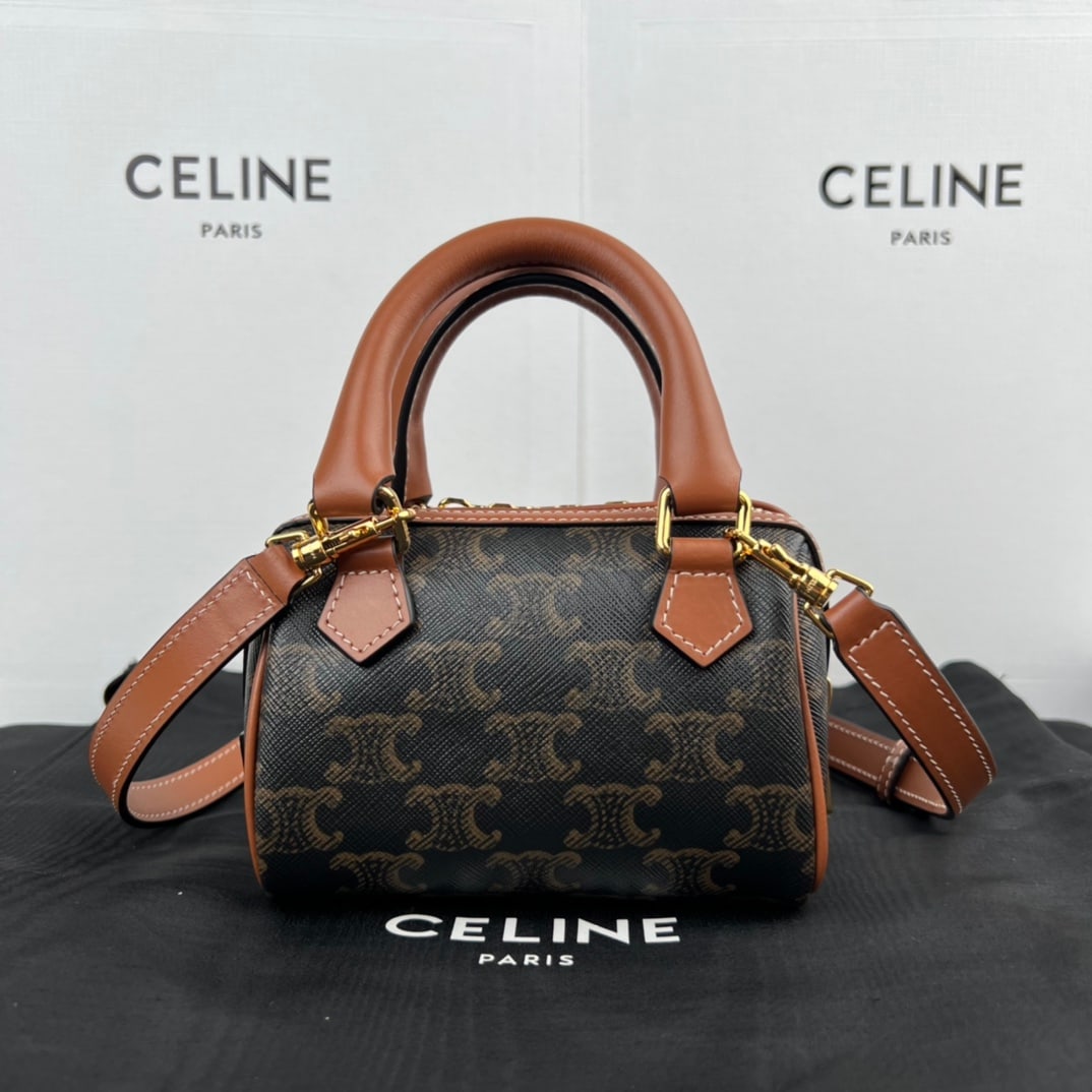 Celine Triophe: TRIOMPHE Mini Boston Bag in Faux Leather (6 x 4 x 3 inches, 14 x 9.5 x 8 cm) features TRIOMPHE CANVAS logo print, cowhide leather trim, fabric lining, gold-tone hardware, zip closure, adjustable and d