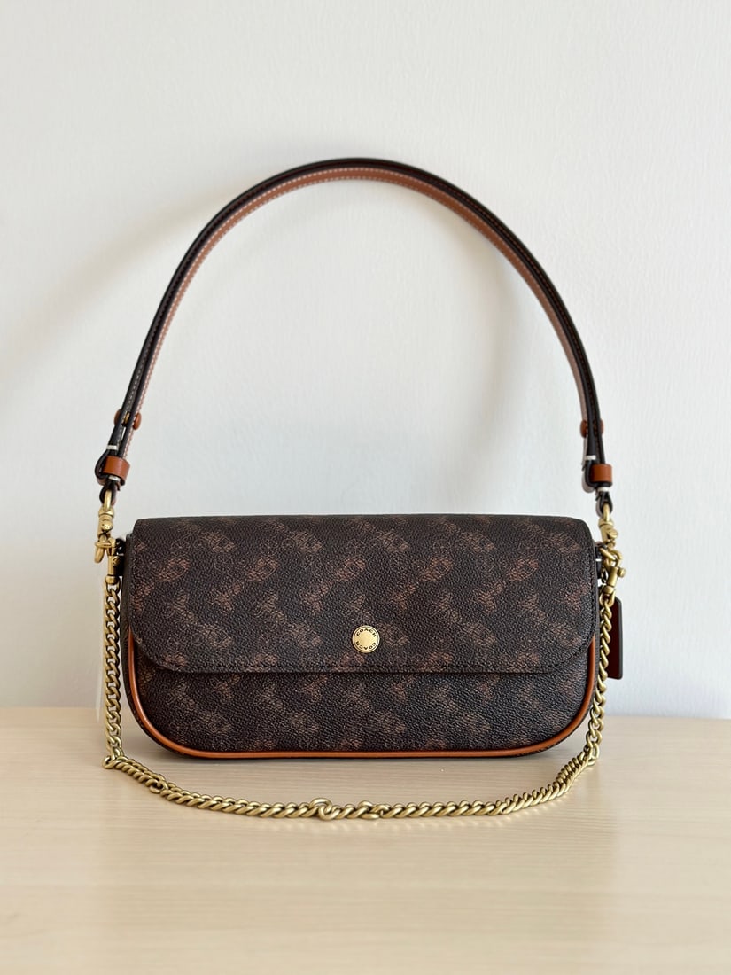 Coach Brook: The Coach Brook baguette bag comes in two materials: cowhide and monogram canvas. It's incredibly lightweight and offers three carrying options to suit various styles. The double shoulder straps are d