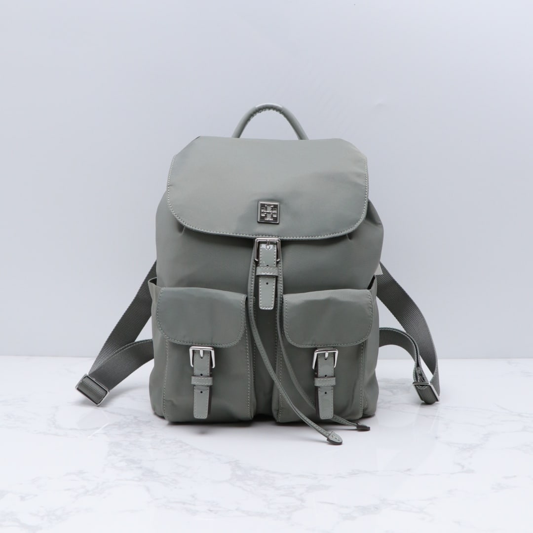 TB: TB Nylon Backpack, waterproof nylon fabric, drawstring closure; flap with magnetic snap closure under the buckle; top handle; vertical carrying height 8cm; adjustable mesh shoulder straps; 2 exterior