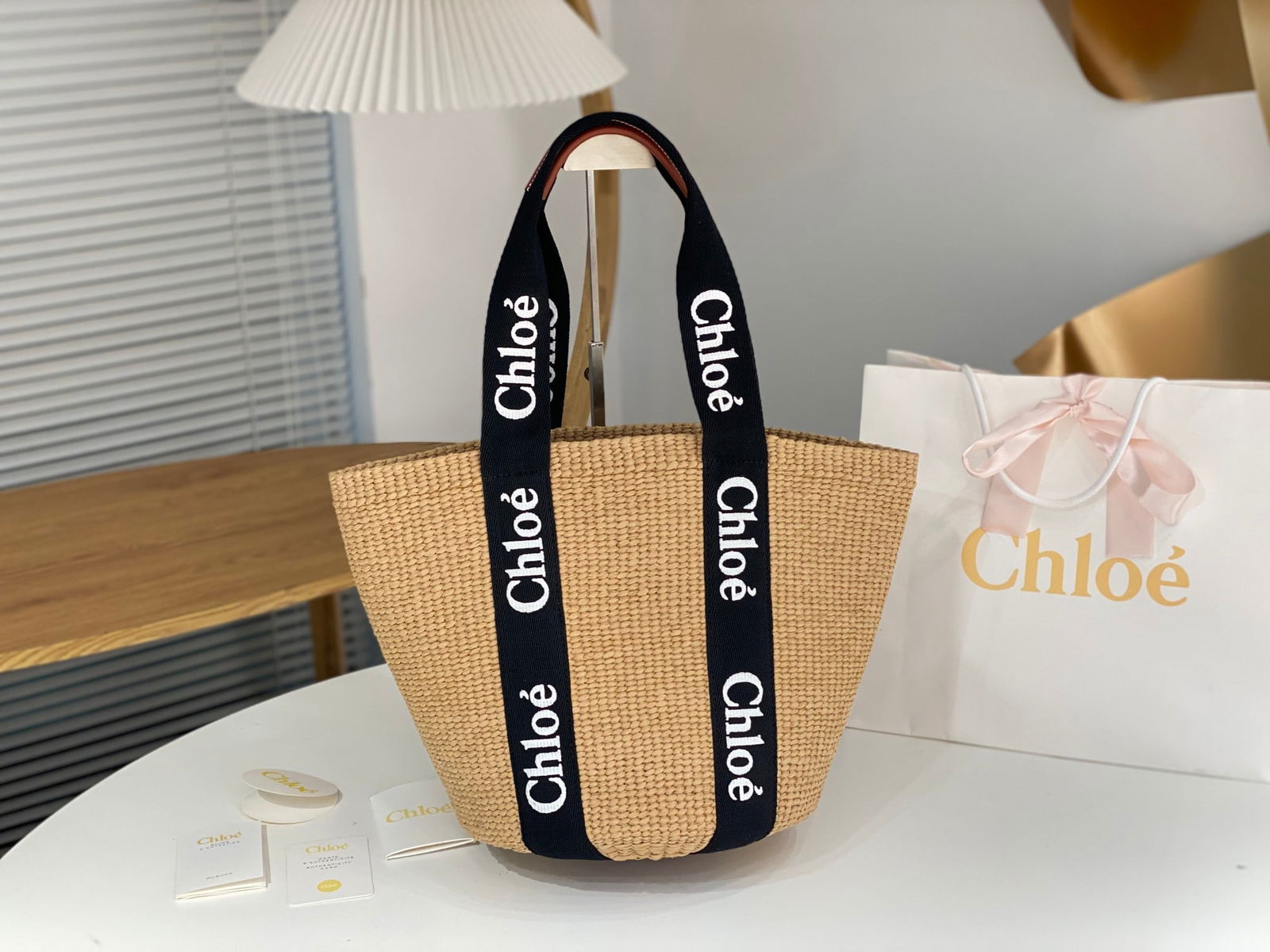 Chloe Woody: Chloe Woody's large straw bag in panda colorway is now available. The most popular Chloe Woody straw bag comes in two color options: a white one with a soft cotton ribbon for a gentle look, and a blac