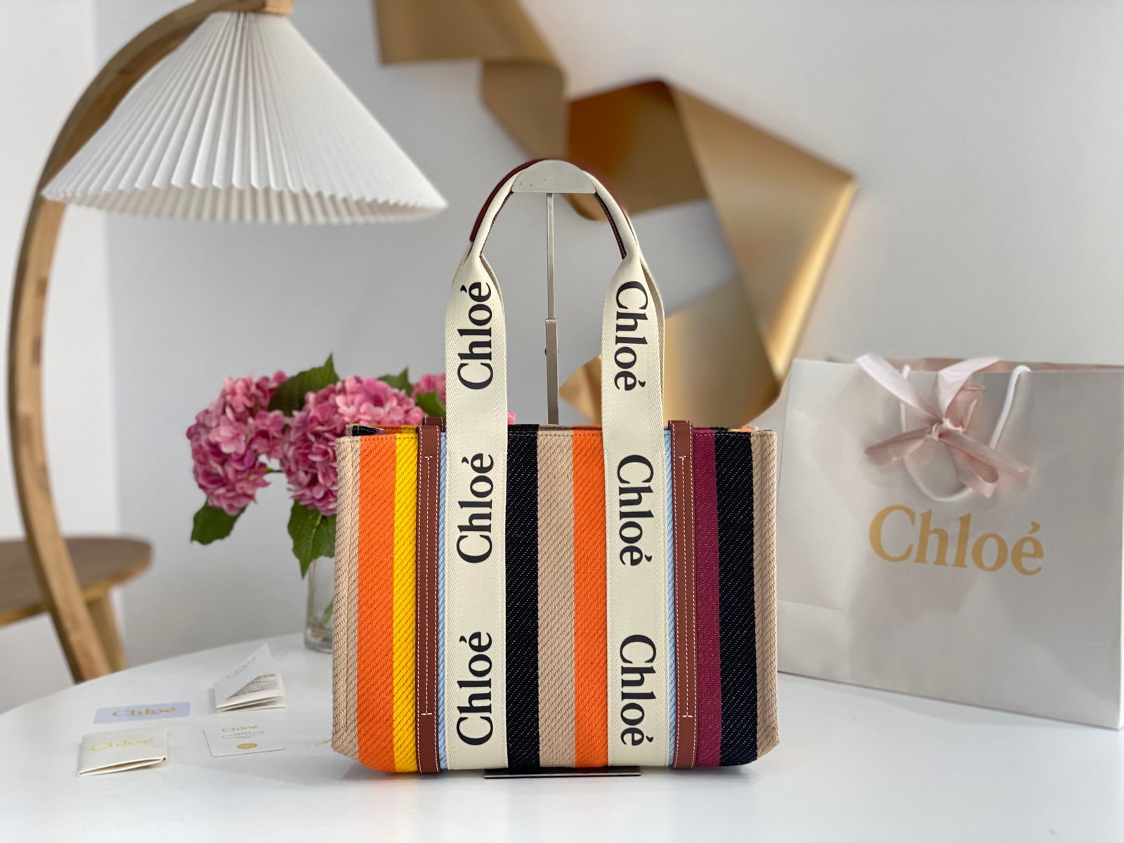 Chloe Woody: This medium-sized Chloe Rainbow Woody tote bag features a beautiful rainbow color and is made of linen striped cotton fabric with a very high-quality feel. The shoulder strap is adjustable, allowing i