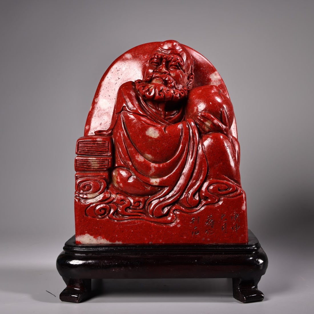 Chicken-blood stone high-relief carving of mountain-shaped figures and arhats. (1 of 11)