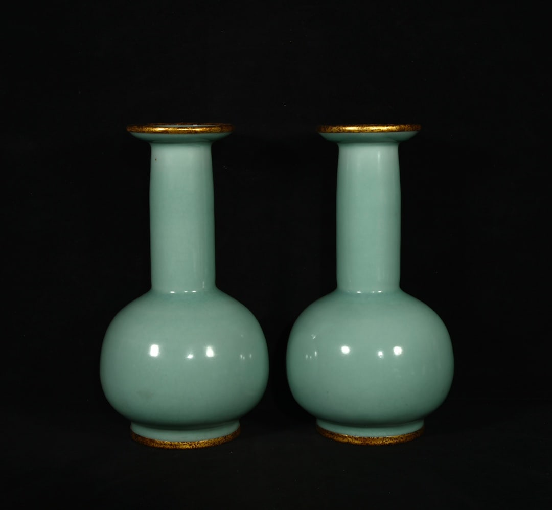 A pair of Song Dynasty Longquan celadon-glazed vases with gold-rimmed mouths. (1 of 9)
