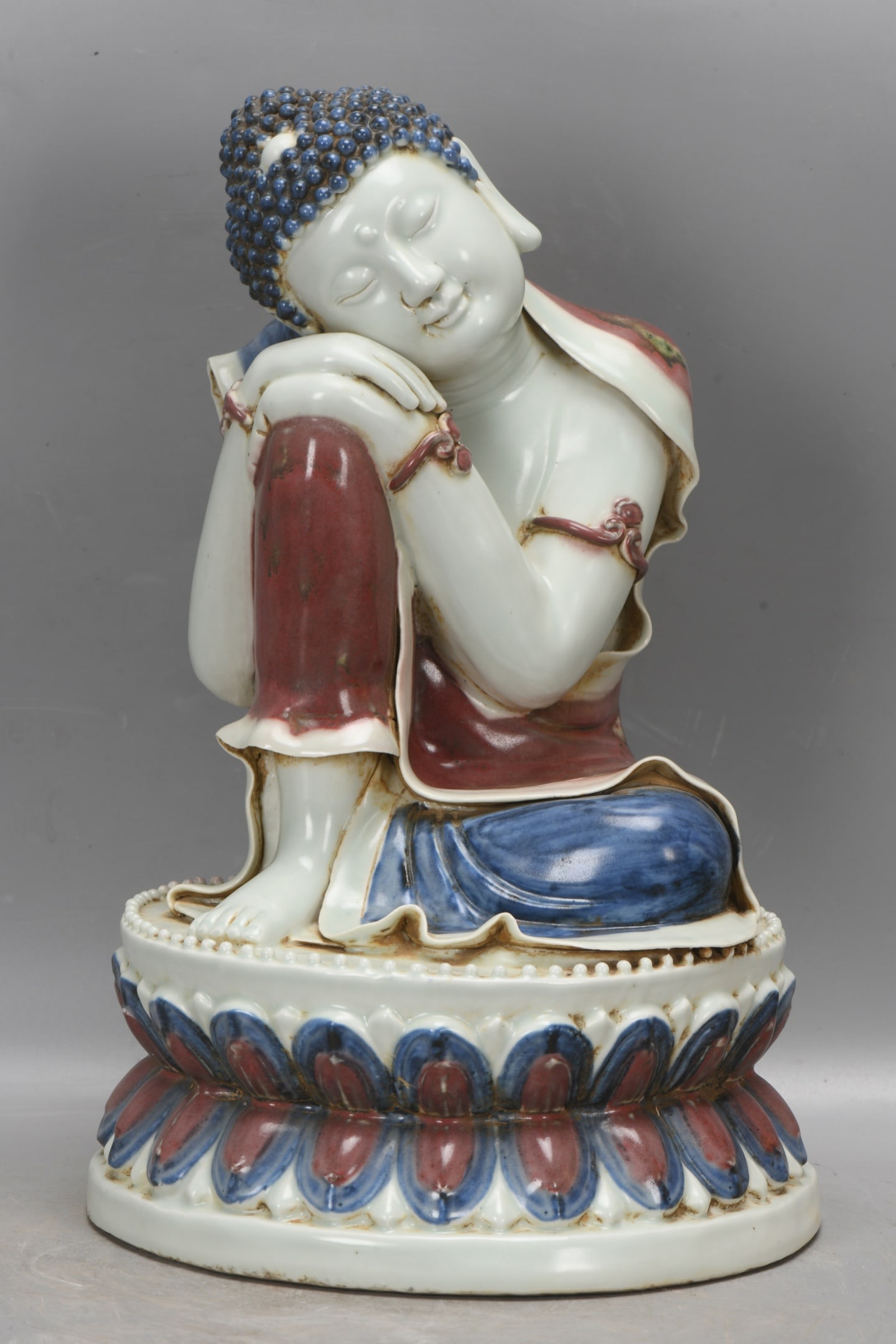 A Yuan Dynasty blue and white underglaze red reclining Buddha statue (1 of 9)