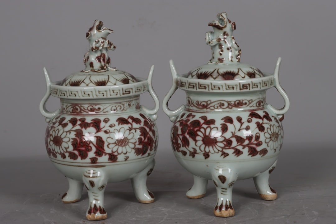 A pair of Yuan Dynasty underglaze red three-legged double-eared floral and animal-head incense (1 of 9)