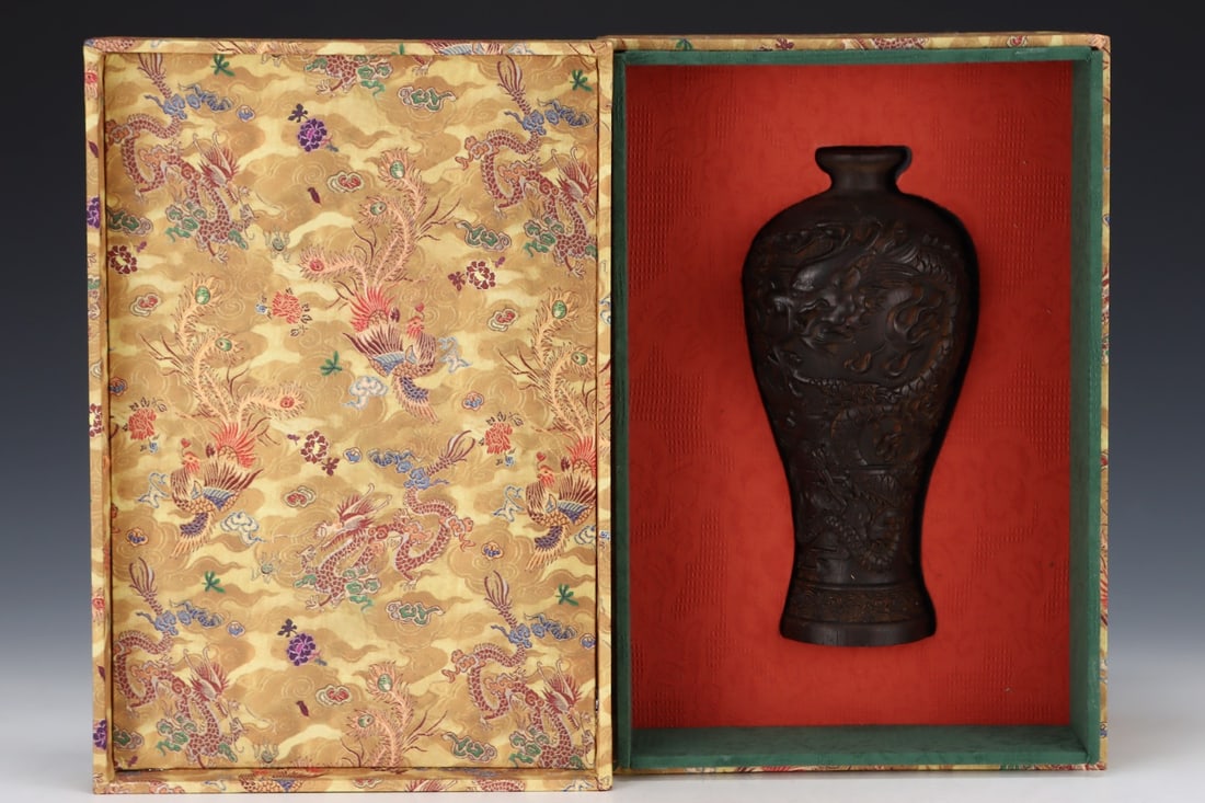 A collection of agarwood ornaments from the imperial collection, featuring a dragon and phoenix (1 of 9)