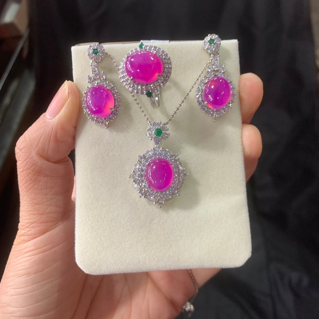 Jadeite Icy Violet Inlaid Diamond Cabochon Pendant Three-Piece Set: A three-piece set of jadeite icy violet jadeite pendants inlaid with diamonds. The stones are lustrous and translucent, exquisitely three-dimensional, round and full, and perfectly flawless. Provenanc