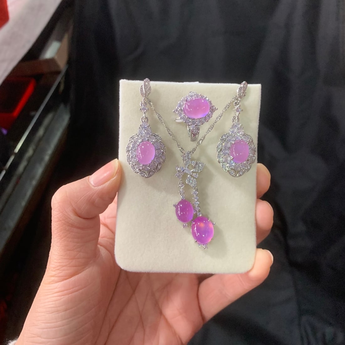 Jadeite Icy Violet Inlaid Diamond Cabochon Pendant Three-Piece Set: A three-piece set of jadeite icy violet jadeite pendants inlaid with diamonds. The stones are lustrous and translucent, exquisitely three-dimensional, round and full, and perfectly flawless. Provenanc