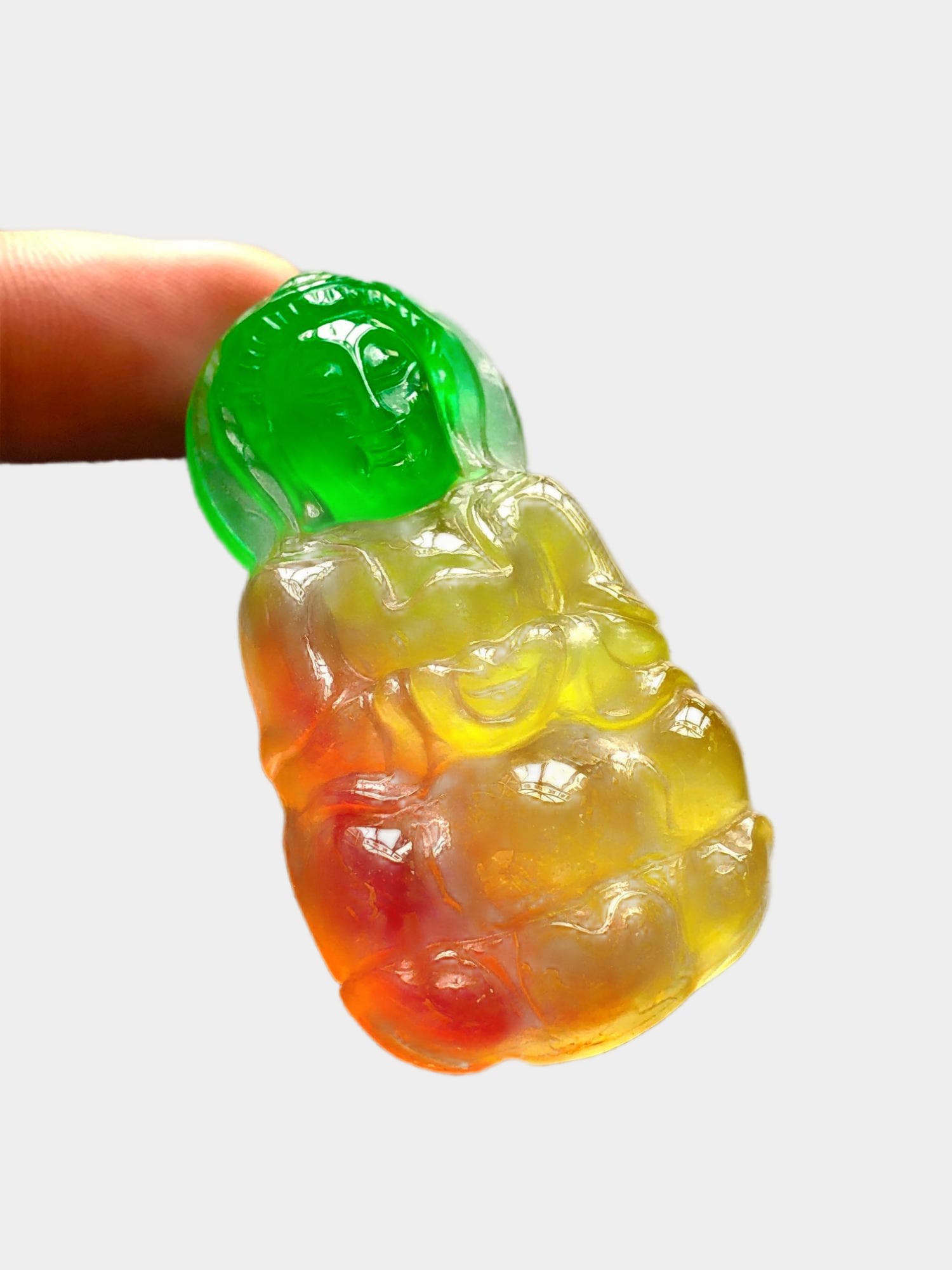 High-Ice, High-Fluorescence, Multicolored Jadeite Guanyin Pendant: High-quality, highly fluorescent, multi-colored jadeite Guanyin pendant. Completely carved, with a beautifully detailed and three-dimensional face. Beautiful color, icy and translucent, with a smooth