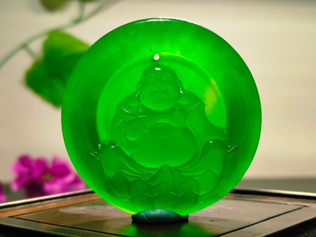 Dragon Stone Imperial Green Jadeite Maitreya Buddha Pendant: Dragon Stone Imperial Green Jadeite Maitreya Buddha Pendant Provenance:From a private collection in Sussex, United Kingdom. Our cooperative logistics services provider expertly handles both domestic a