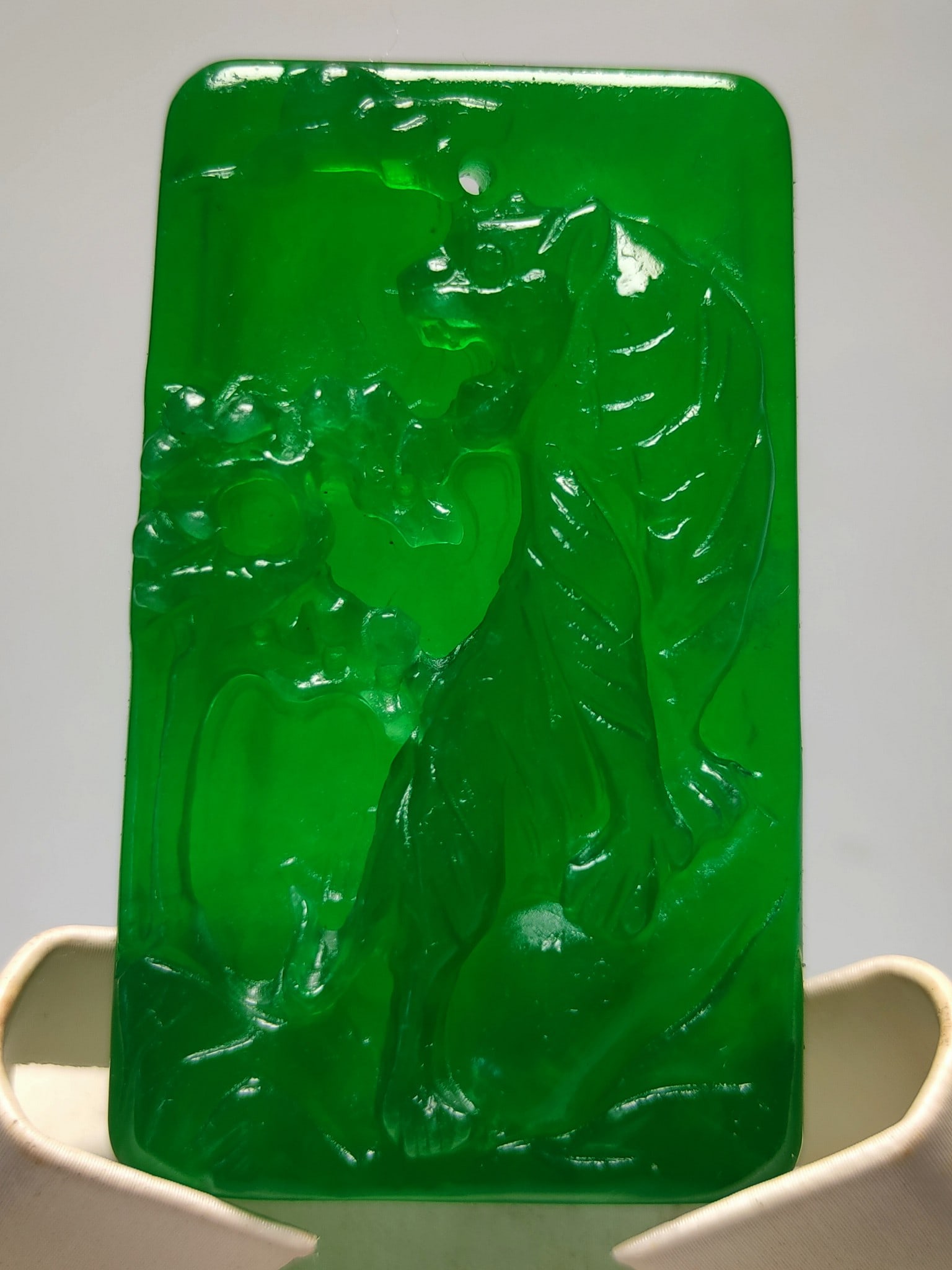 A top-grade icy imperial green jadeite pendant, featuring a high-relief carving of a tiger climbing (1 of 8)