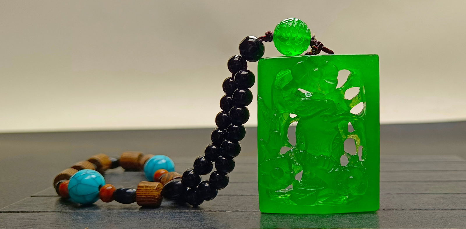 Top-grade dragon stone type imperial green extra-large and extra-thick jadeite hand-held piece: Top-grade imperial green jadeite hand-carved piece, exceptionally large and thick, with superb translucency. Absolutely perfect, double-sided carving. Provenance:from the collection of George Stopher,