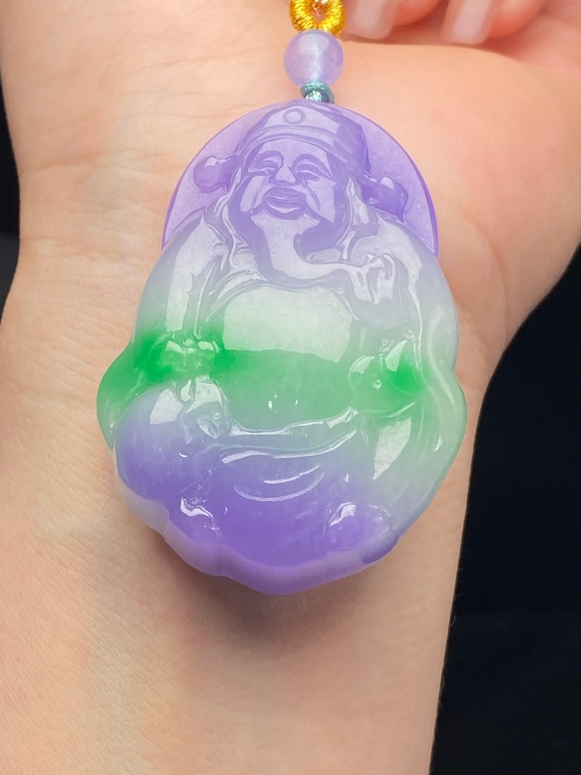 Jadeite "God of Wealth" pendant, glutinous type, purple and green.: This jadeite pendant, a glutinous type with purple and green hues, depicts the God of Wealth. It is thick, full, exquisitely three-dimensional, and flawlessly flawless. Provenance:from the collection