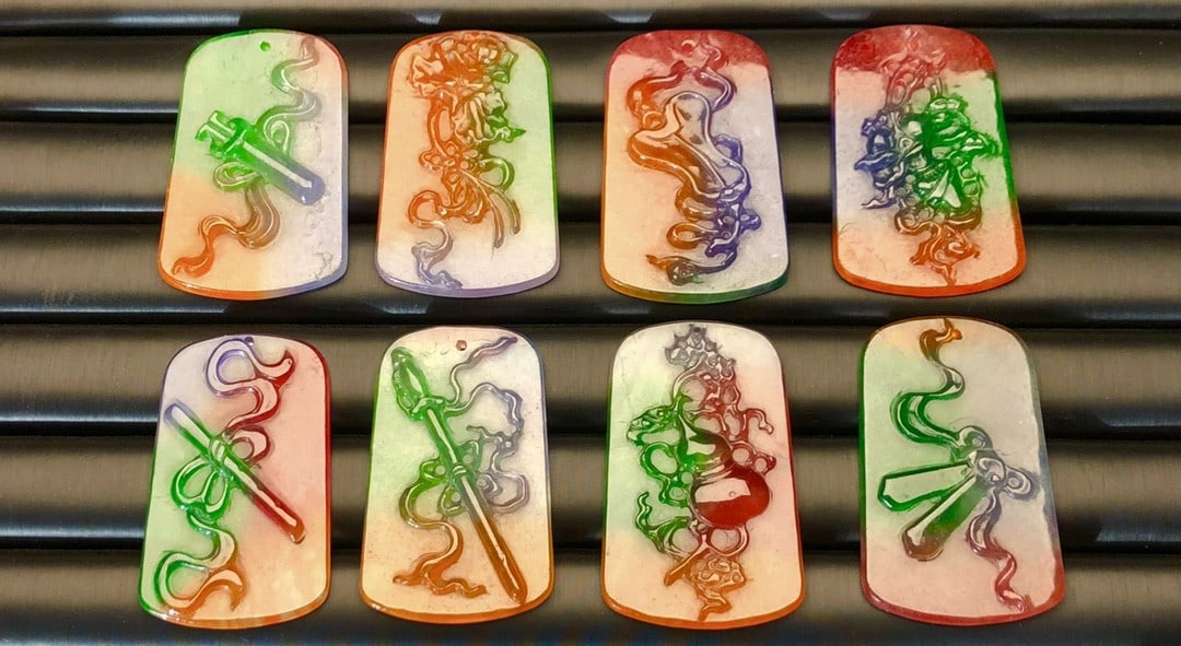 High-quality, multicolored jadeite pendant featuring the Eight Immortals and Eight Treasures.: This is a high-quality, multi-colored jadeite pendant featuring the Eight Immortals and Eight Treasures. Made from superior materials, it is icy and translucent, with full color and clarity. The