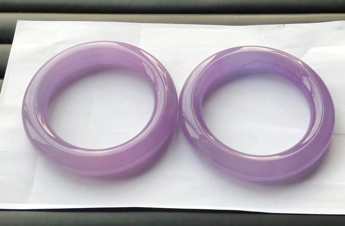 A pair of violet high-ice jadeite round bracelets (1 of 9)