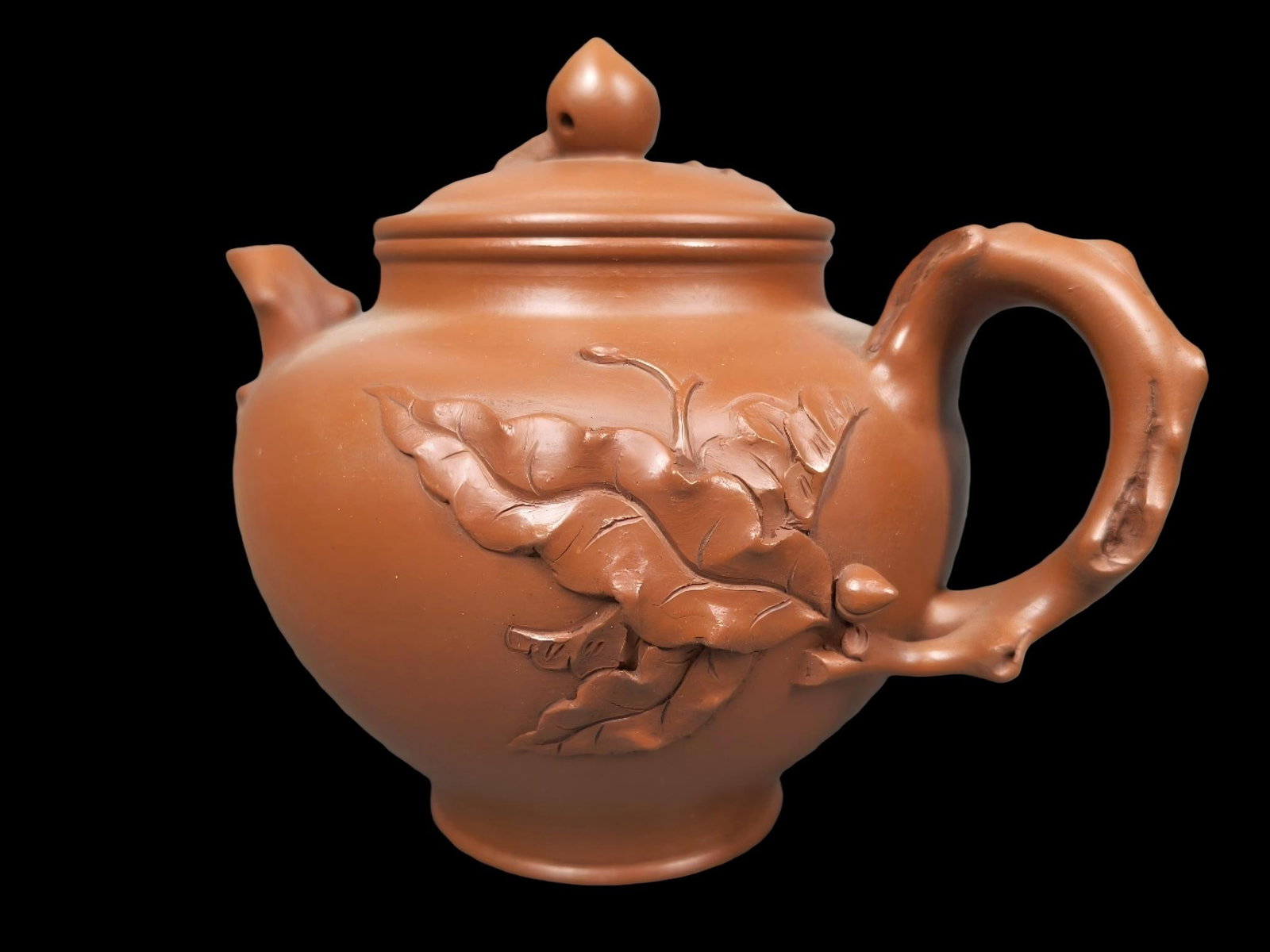 A treasured Zisha teapot with a hand-carved peach blossom design by a famous artist. (1 of 9)