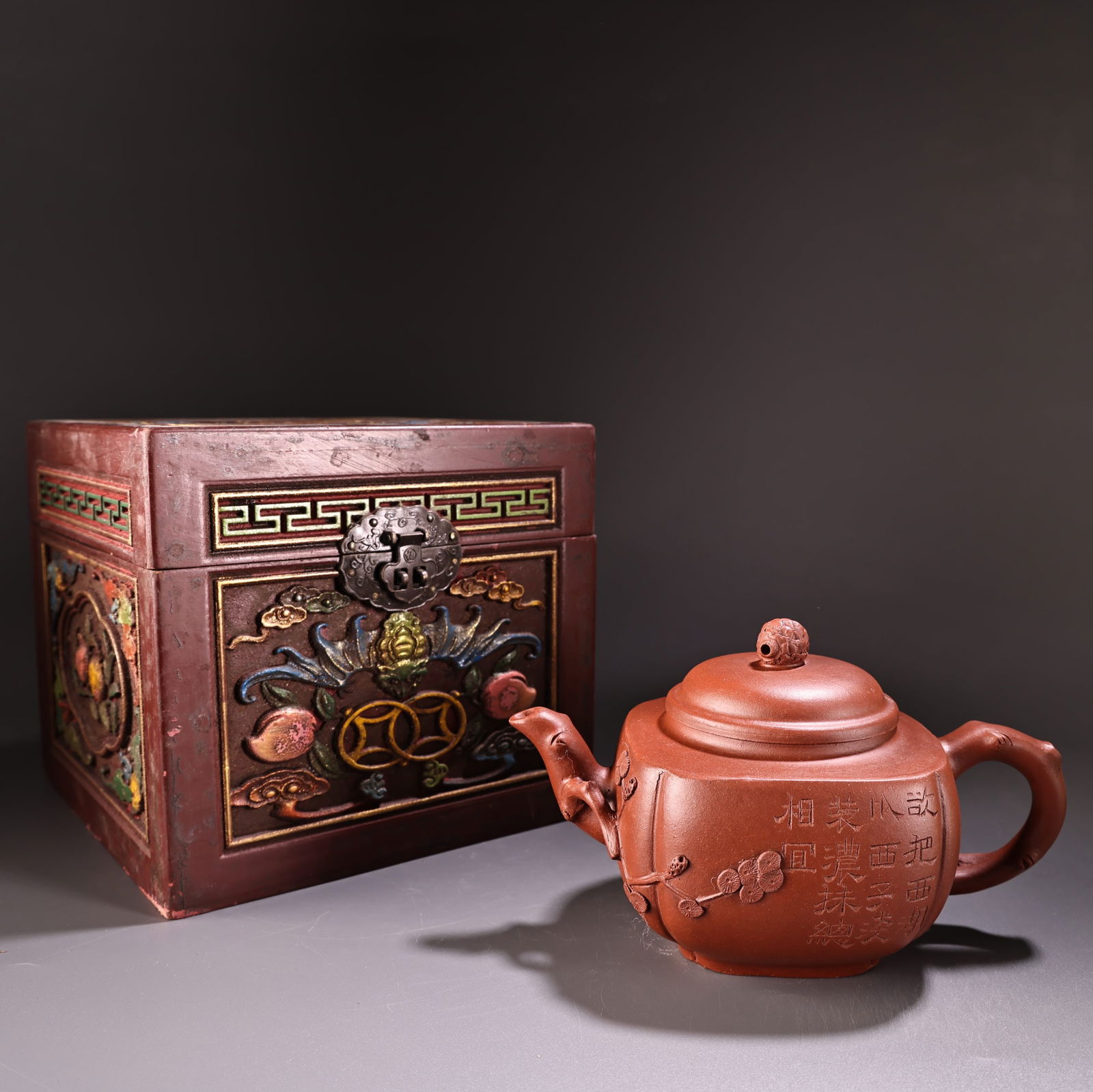 A fine antique handmade Zisha teapot from a rare collection.: A fine antique handmade Zisha teapot, exquisitely crafted and beautifully shaped, comes with an antique wooden box. The teapot weighs 520 grams, is 11 cm high and 19 cm wide. Provenance:from the colle