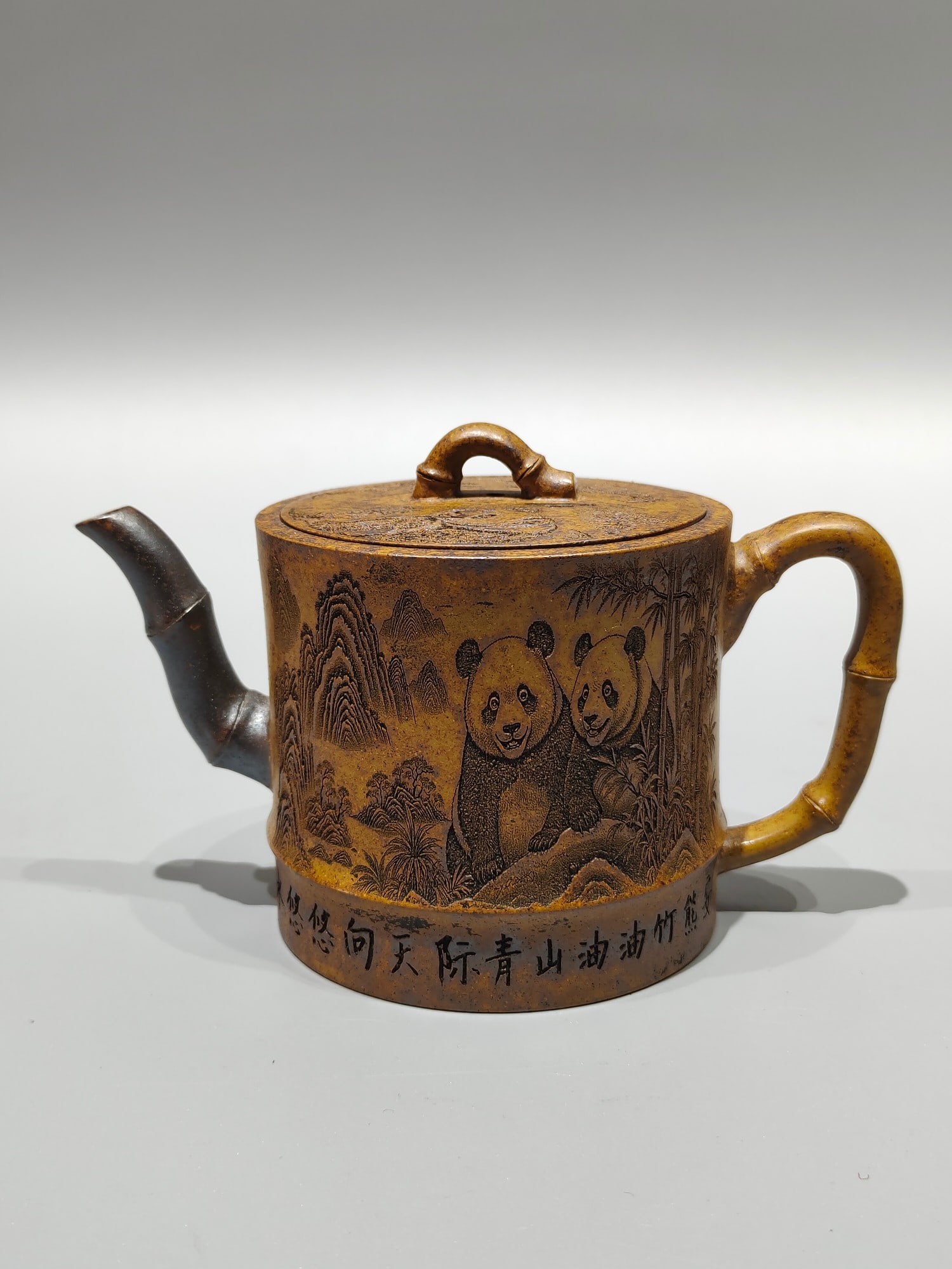 A treasured antique purple clay teapot with engraving. (1 of 7)