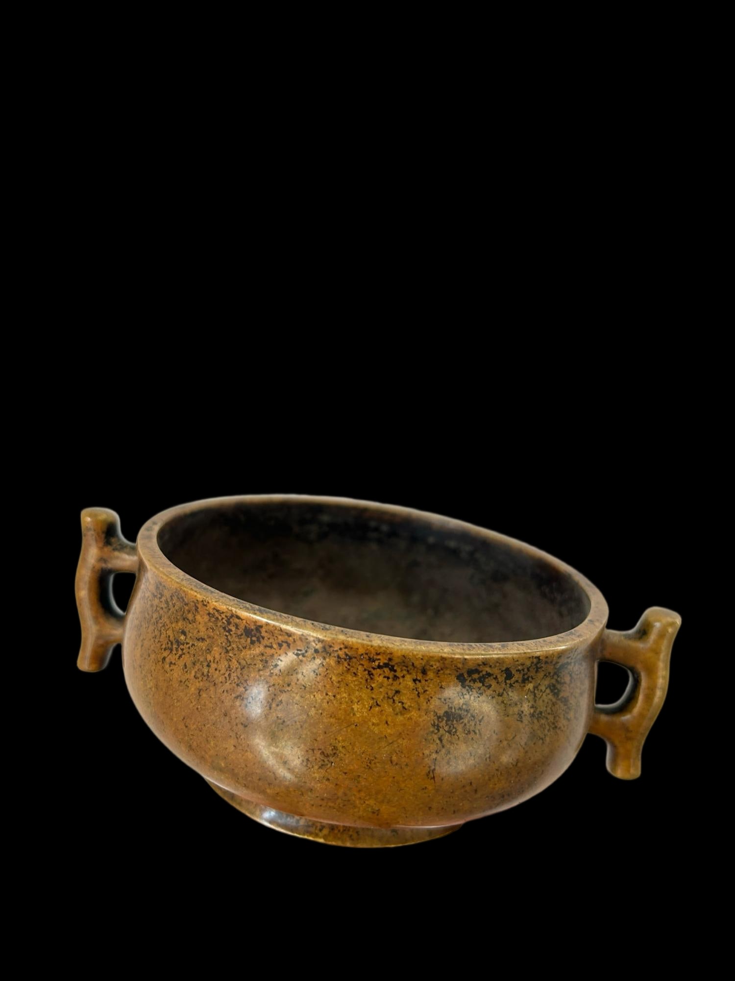 A bronze incense burner with round feet and halberd-shaped handles, bearing the mark of the Xuande (1 of 8)