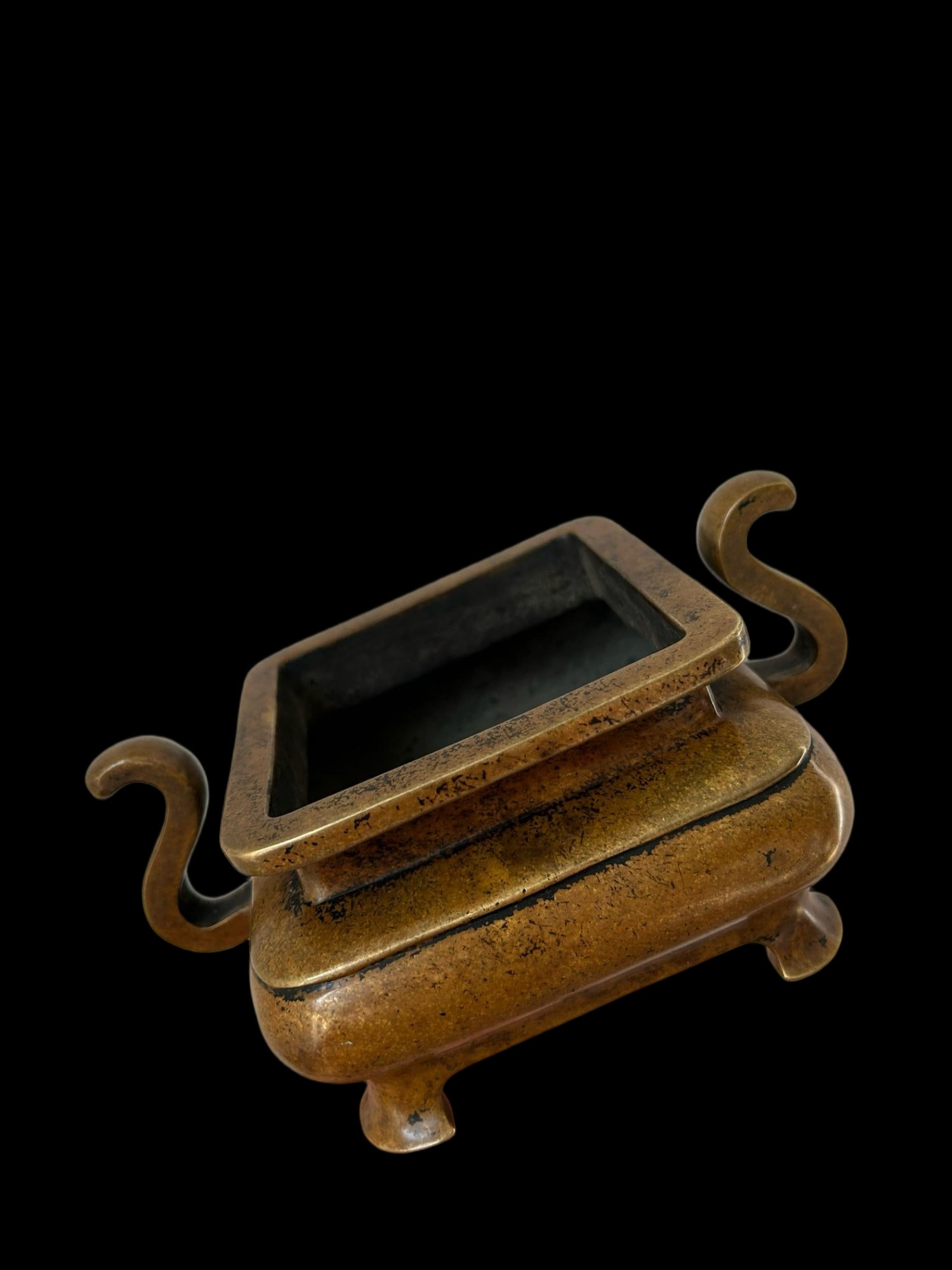 A square bronze incense burner with four legs and scroll-shaped handles, bearing the mark of the (1 of 8)