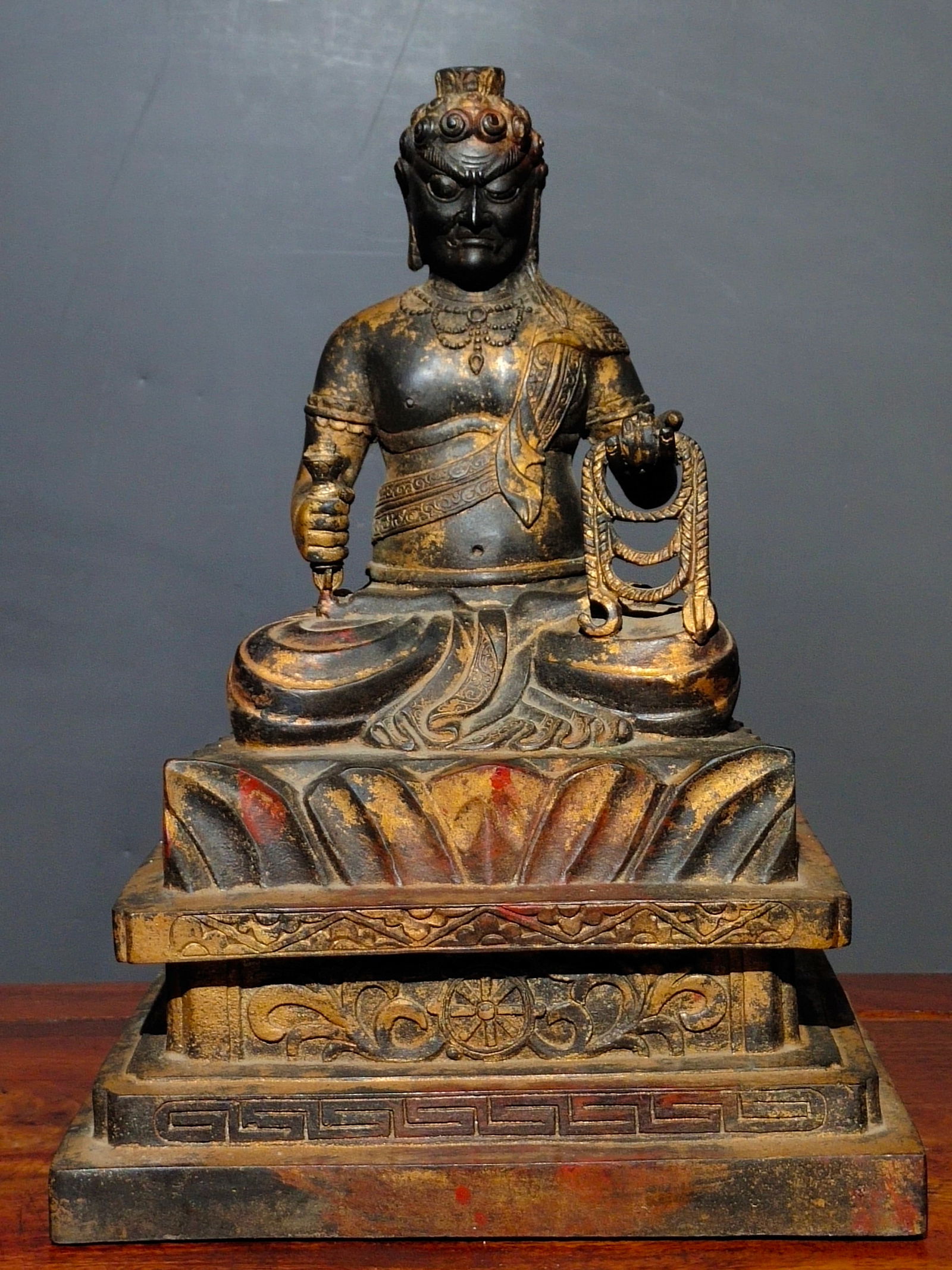 This is a rare pure copper gilded Buddha statue, featuring the image of Acala (Fud?? My??-??). The: This is a rare pure copper gilt-painted Buddha statue, featuring the Acala (Fud?? My??-??) Buddha. The statue is simple and dignified, with a thick copper base and mottled gilt paint of a serene color